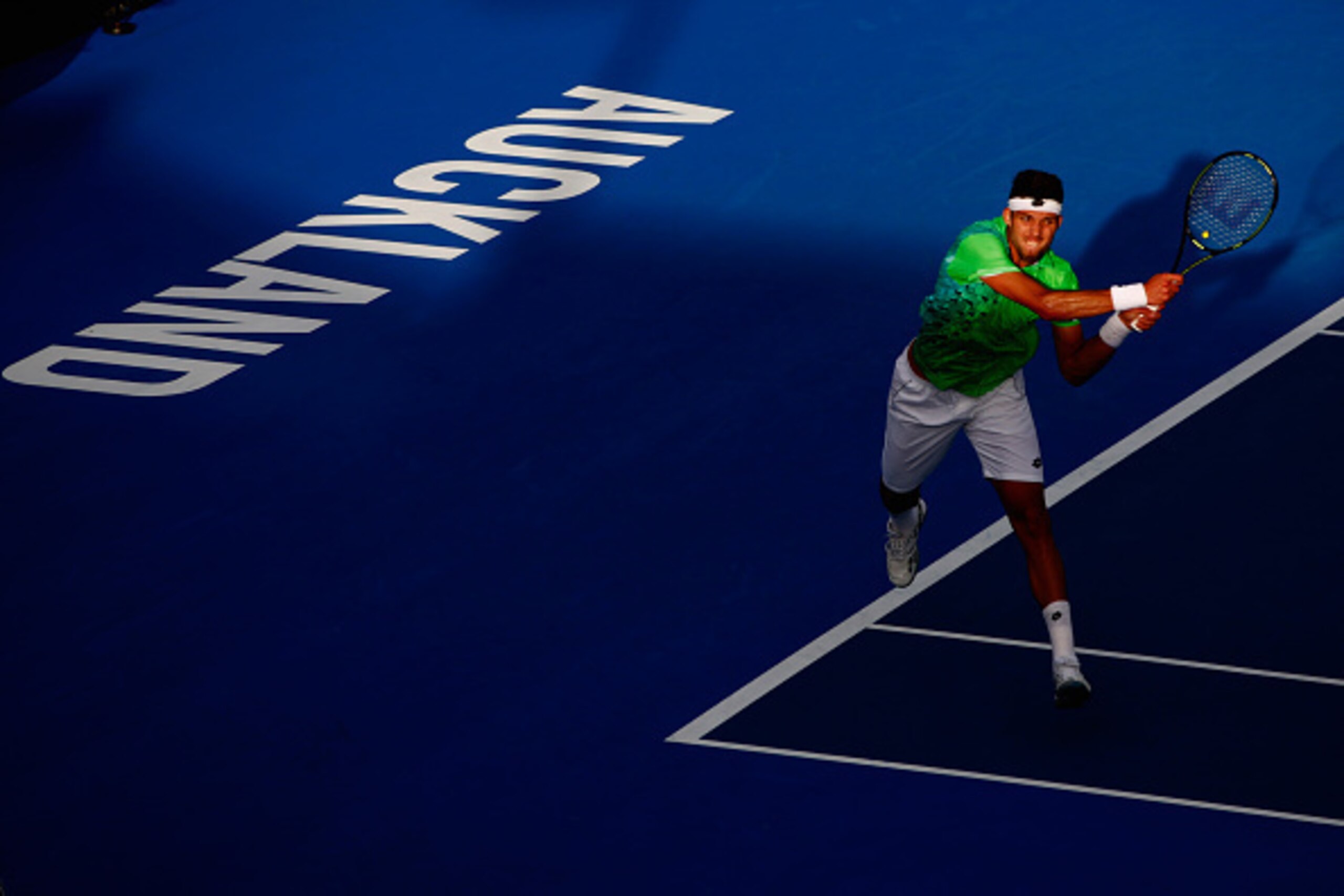 AUCKLAND, NEW ZEALAND - JANUARY 12:  Jiri Vesely of the Czech Republic plays a backhand against  Roberto Agut Bautista of Spain in their singles match on Day 8 of the ASB Classic on January 12, 2016 in Auckland, New Zealand.  (Photo by Phil Walter/Getty I