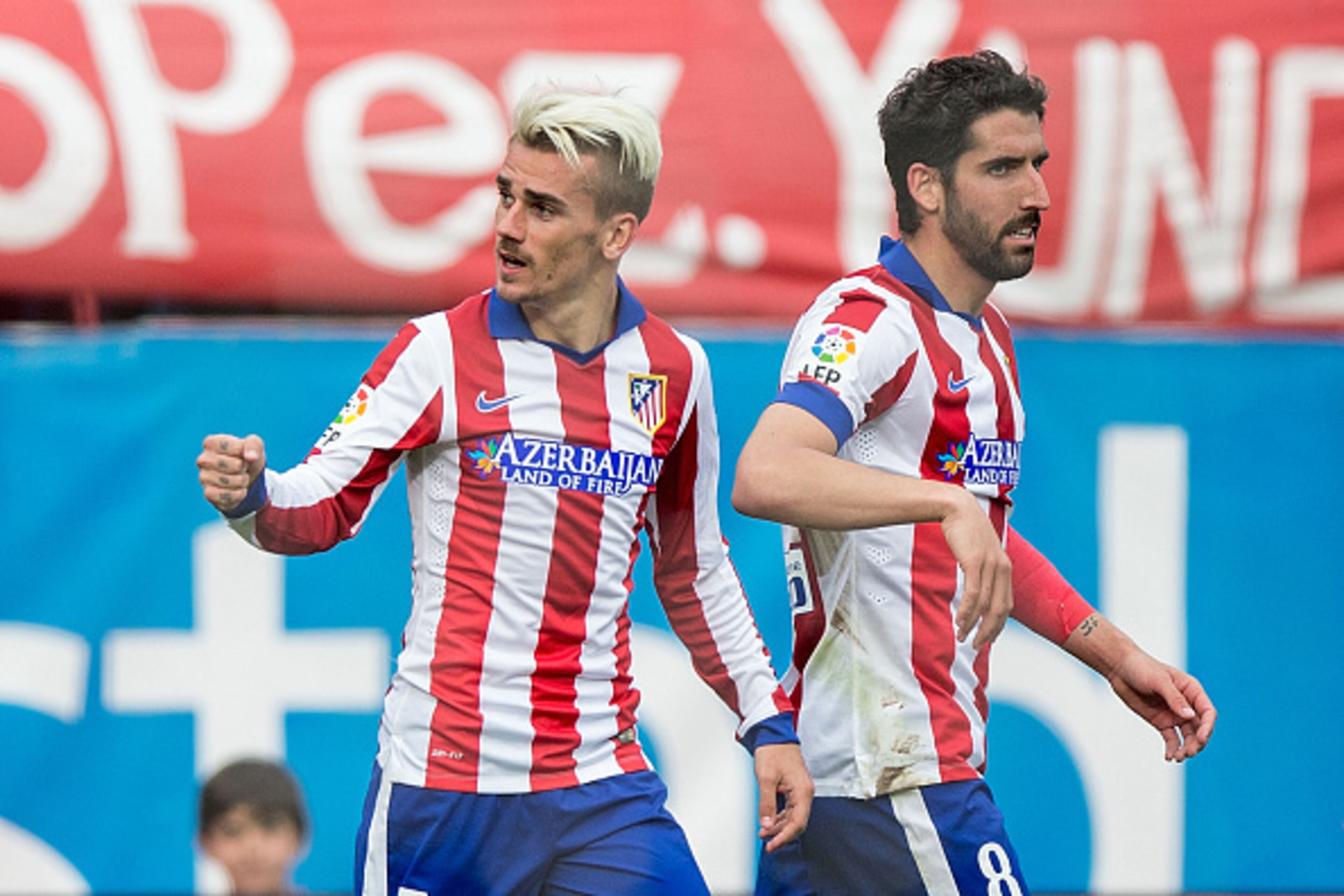 MADRID, SPAIN - APRIL 25: Antoine Griezmann (L) of Atletico de Madrid celebrates scoring their opening goal with teammate Raul Garcia (R) during the La Liga match between Club Atletico de Madrid and Elche FC at Vicente Calderon Stadium on April 25, 2015 MADRID, SPAIN - APRIL 25: Antoine Griezmann (L) of Atletico de Madrid celebrates scoring their opening goal with teammate Raul Garcia (R) during the La Liga match between Club Atletico de Madrid and Elche FC at Vicente Calderon Stadium on April 25, 2015