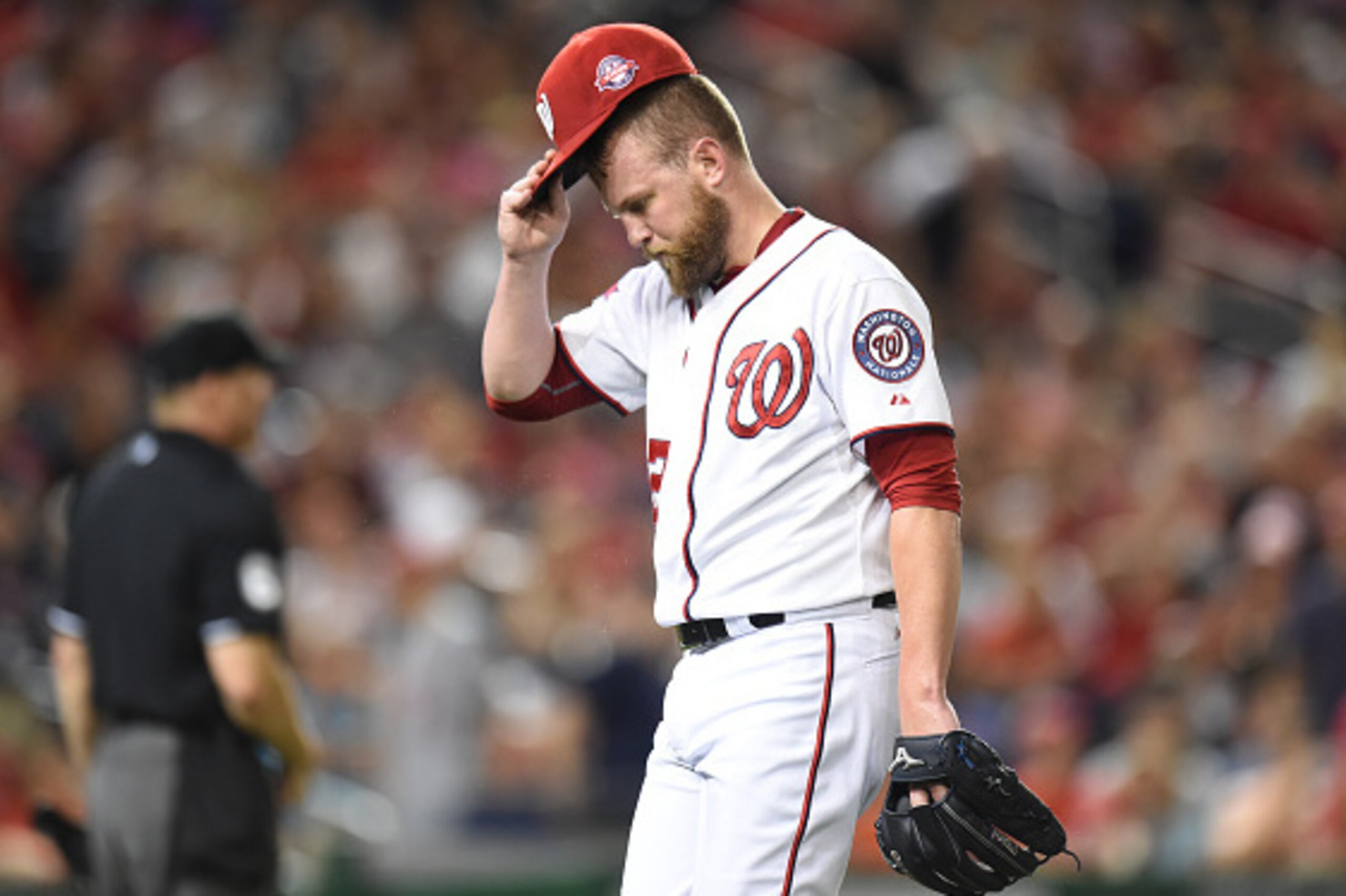 WASHINGTON, DC - AUGUST 07:  Drew Storen #22 of the Washington Nationals walks back to the dug out after giving a grand slam to Carlos Gonzalez #5 (not pictured) of the Colorado Rockies during a baseball at Nationals Park on August 7, 2015 in Washington, 