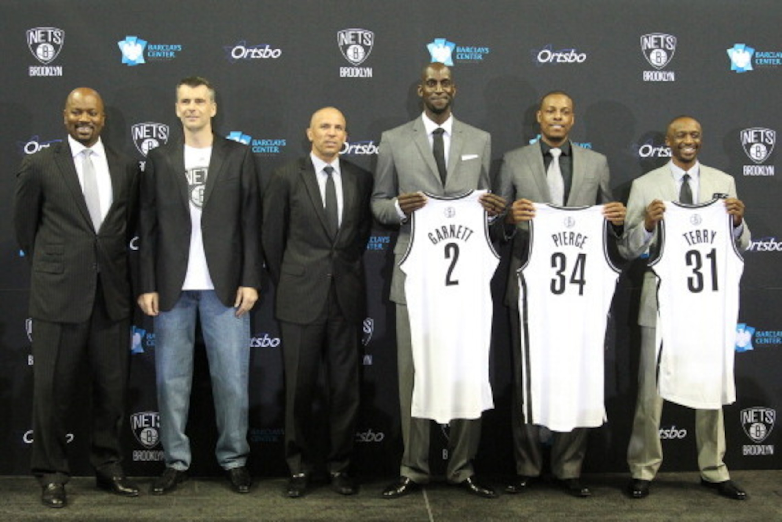 BROOKLYN, NY - July 18: General Manager Billy King, majority owner Mikhail Prokhorov, Head Coach Jason Kidd, Kevin Garnett #2, Paul Pierce #34, and Jason Terry #31 of the Brooklyn Nets pose during a press conference at the Barclays Center on July 18, 2013 BROOKLYN, NY - July 18: General Manager Billy King, majority owner Mikhail Prokhorov, Head Coach Jason Kidd, Kevin Garnett #2, Paul Pierce #34, and Jason Terry #31 of the Brooklyn Nets pose during a press conference at the Barclays Center on July 18, 2013