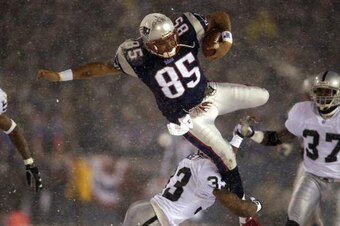 19 Jan 2002:  Jermaine Wiggins #85 of the New England Patriots flies through the air when trying to jump over Anthony Dorsett #33 of the Oakland Raiders during the AFC playoff game at Foxboro Stadium in Foxboro, Massachuesetts. The Patriots came from behi