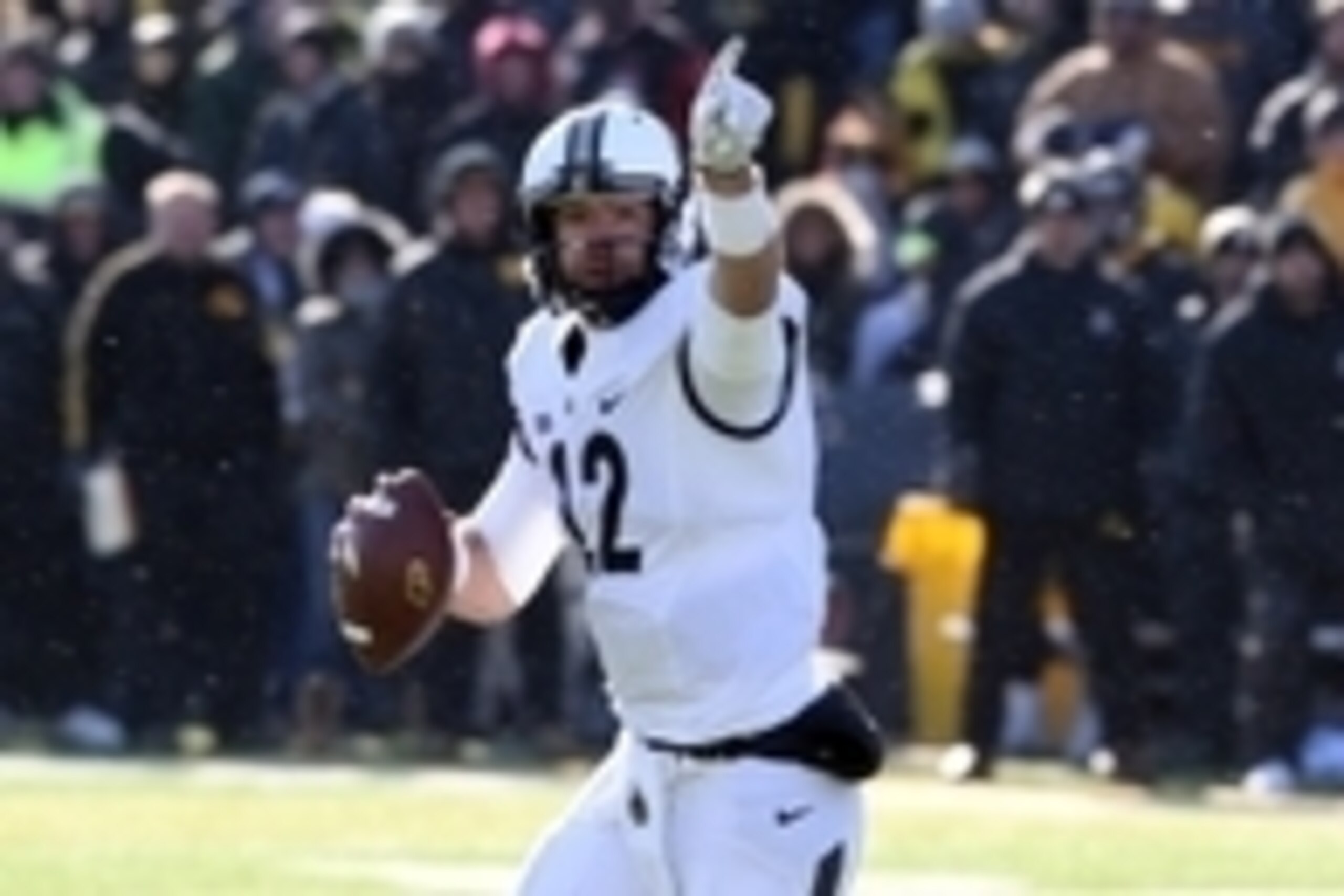 Nov 21, 2015; Iowa City, IA, USA; Purdue Boilermakers quarterback Austin Appleby (12) points downfield against the Iowa Hawkeyes during the fourth quarter at Kinnick Stadium. Iowa beat Purdue 40-20. Mandatory Credit: Reese Strickland-USA TODAY Sports