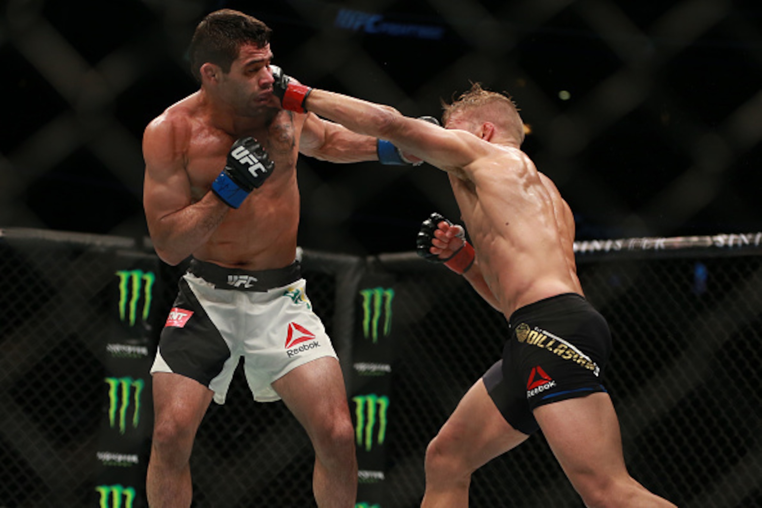 CHICAGO, IL - JULY 25:  TJ Dillashaw (R) and Renan Barao fight in their UFC bantamweight championship bout during the UFC event at the United Center on July 25, 2015 in Chicago, Illinois. (Photo by \Rey Del Rio/Zuffa LLC/Zuffa LLC via Getty Images)