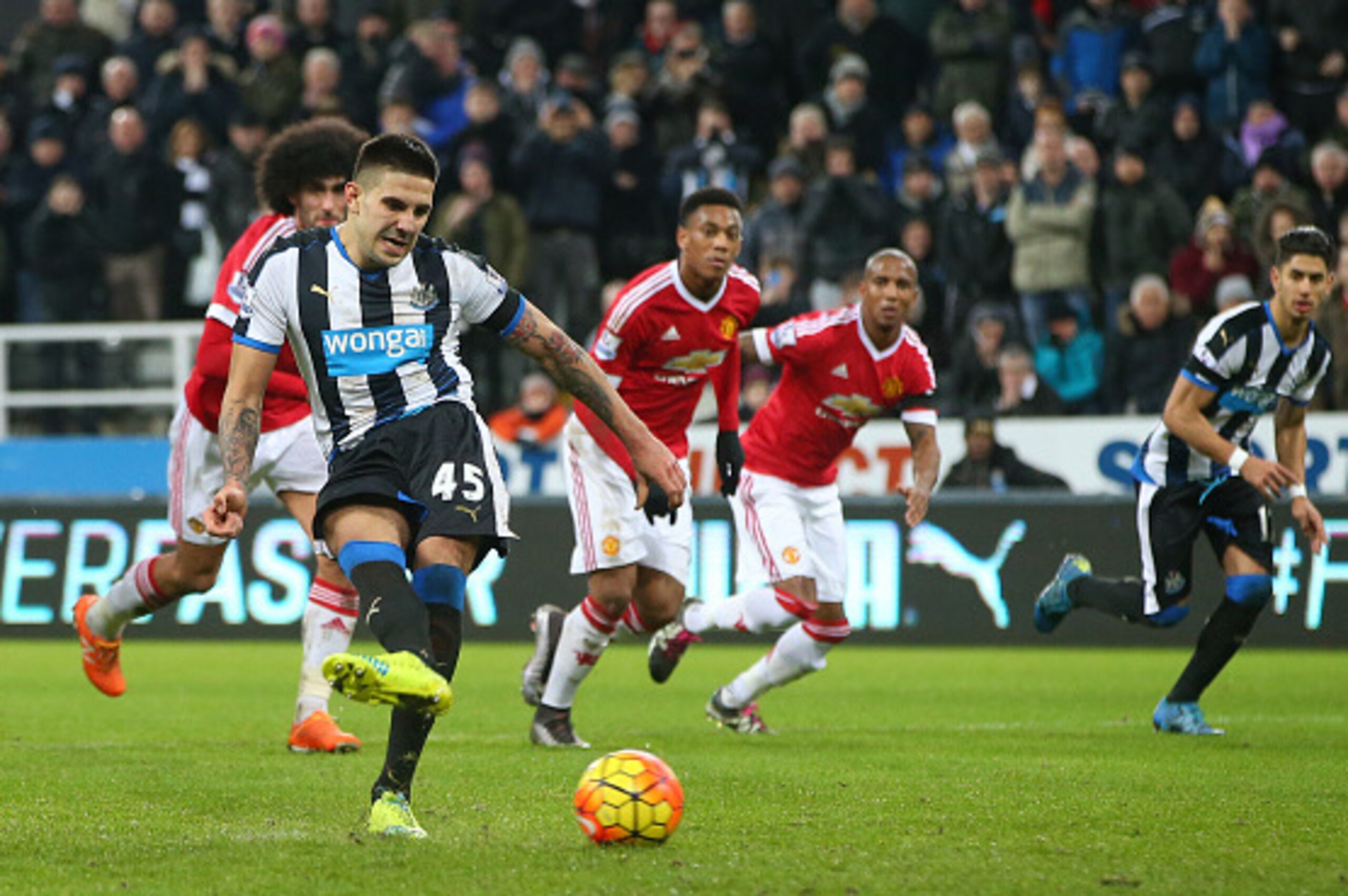 NEWCASTLE UPON TYNE, ENGLAND - JANUARY 12:  Aleksandar Mitrovic of Newcastle United scores their second and equalising goal from a penalty during the Barclays Premier League match between Newcastle United and Manchester United at St James' Park on January