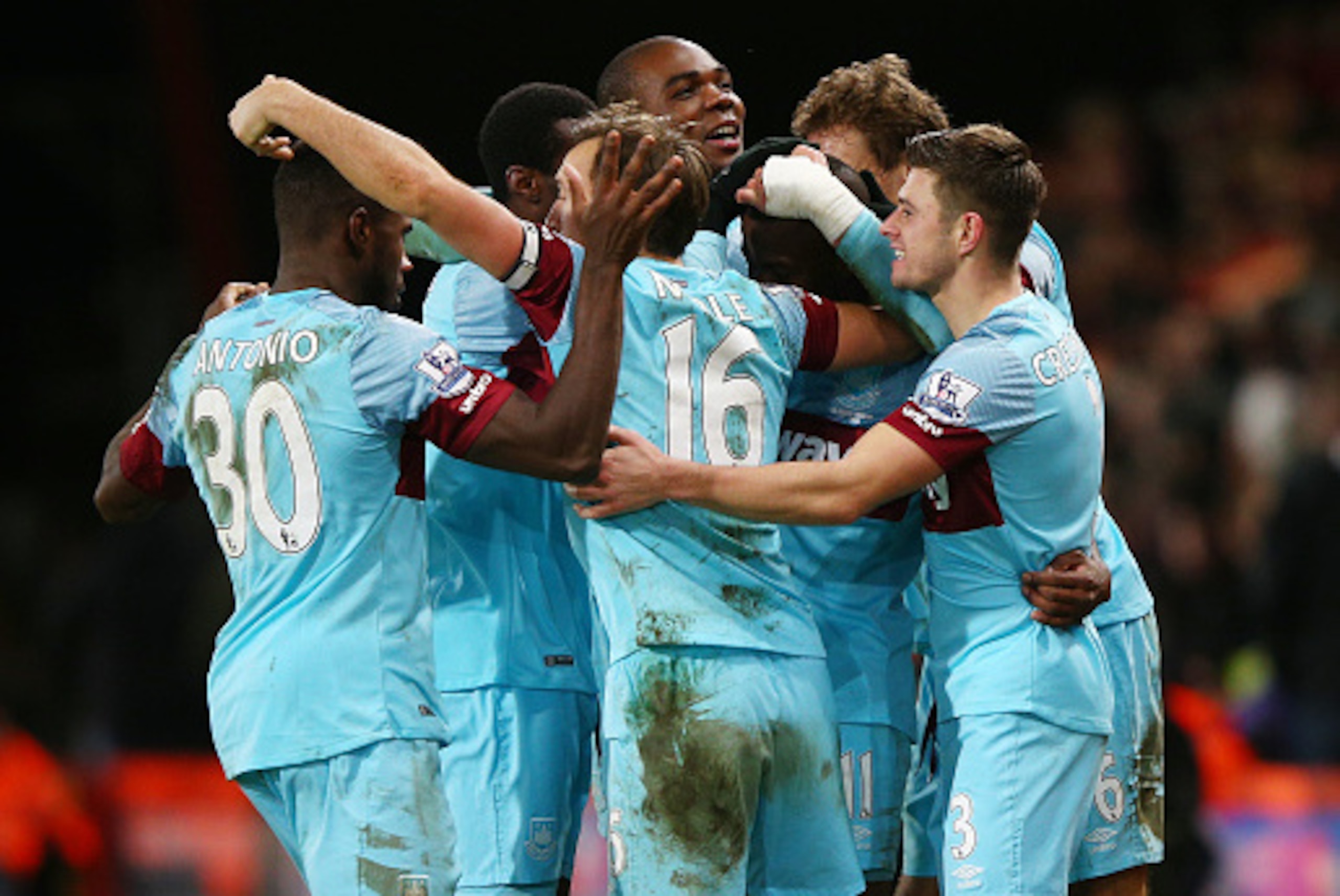 BOURNEMOUTH, ENGLAND - JANUARY 12:  Enner Valencia of West Ham United (11) is mobbed by team mates in celebration as he scores their third goal during the Barclays Premier League match between A.F.C. Bournemouth and West Ham United at Vitality Stadium on
