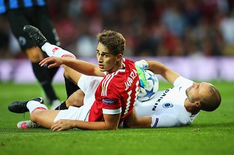 MANCHESTER, ENGLAND - AUGUST 18: Adnan Januzaj of Manchester United collides with Sebastien Bruzzese of Club Brugge during the UEFA Champions League Qualifying Round Play Off First Leg match between Manchester United and Club Brugge at Old Trafford on Au MANCHESTER, ENGLAND - AUGUST 18: Adnan Januzaj of Manchester United collides with Sebastien Bruzzese of Club Brugge during the UEFA Champions League Qualifying Round Play Off First Leg match between Manchester United and Club Brugge at Old Trafford on Au