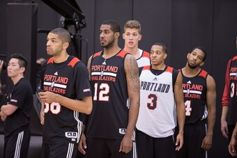 PORTLAND, OR - OCTOBER 3: L-R Nicolas Batum #88, LaMarcus Aldridge #12, Meyers Leonard #11, C.J. McCollum #3 and Darius Morris #4 of the Portland Trail Blazers participate in the team's practice October 3, 2014 at the Trail Blazer Practice Facility in Por