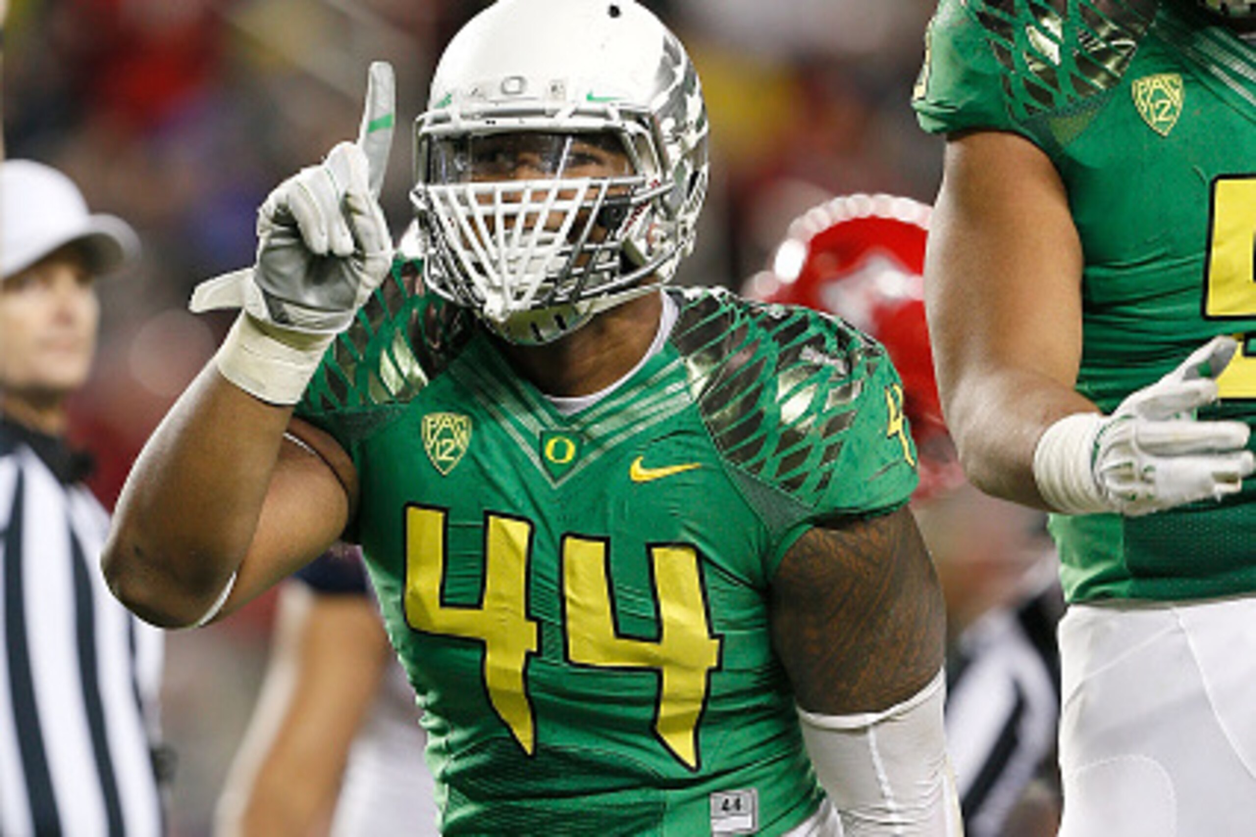 SANTA CLARA, CA - DECEMBER 05: DeForest Buckner #44 of the Oregon Ducks celebrates in front of fans during the first half of the PAC-12 Championships against the Arizona Wildcats at Levi's Stadium on December 5, 2014 in Santa Clara, California. (Photo by 