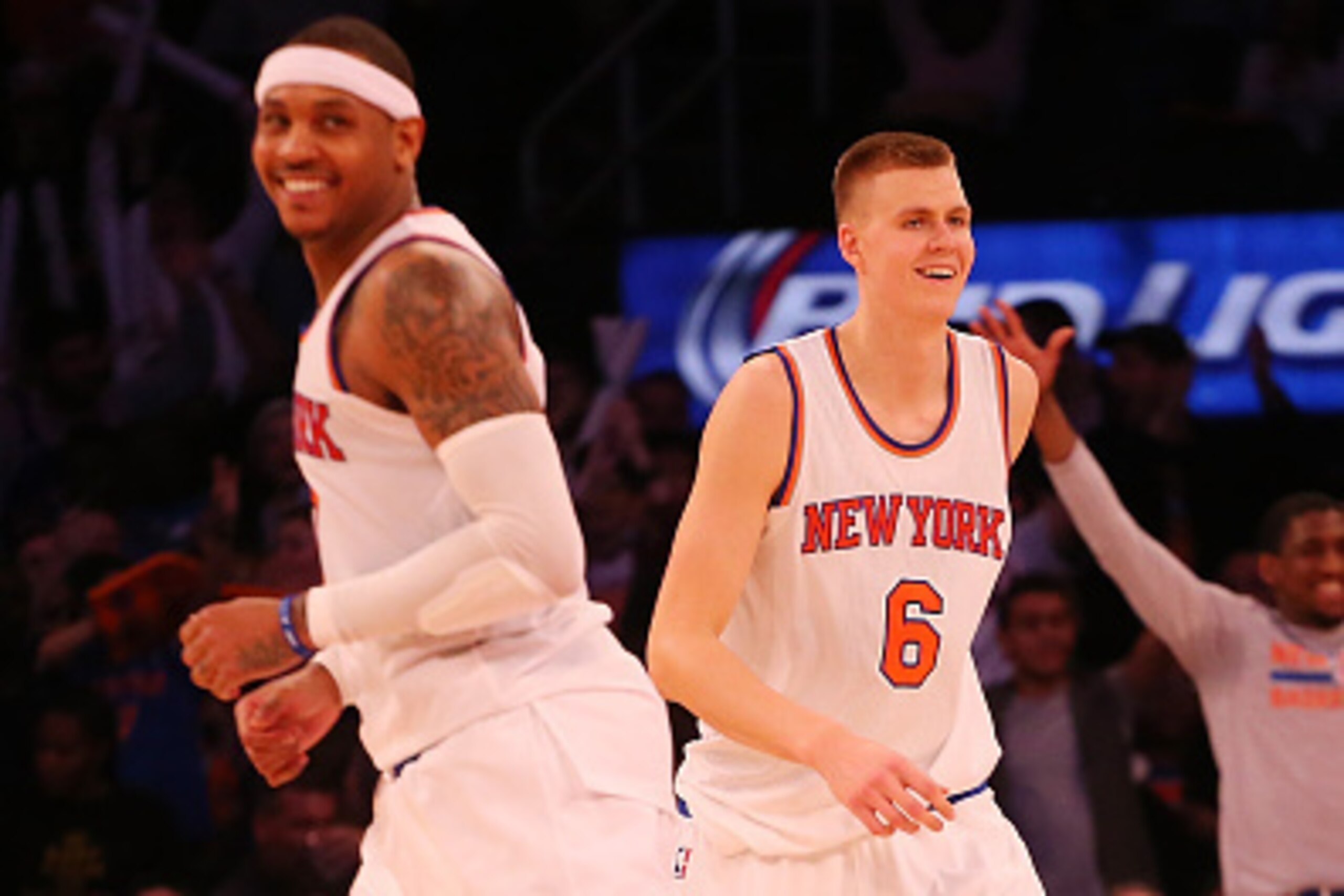 NEW YORK, NY - JANUARY 10:  Kristaps Porzingis #6 of the New York Knicks celebrates a three-pointer with Carmelo Anthony #7 against the Milwaukee Bucks at Madison Square Garden on January 10, 2016 in New York City.  (Photo by Mike Stobe/Getty Images)