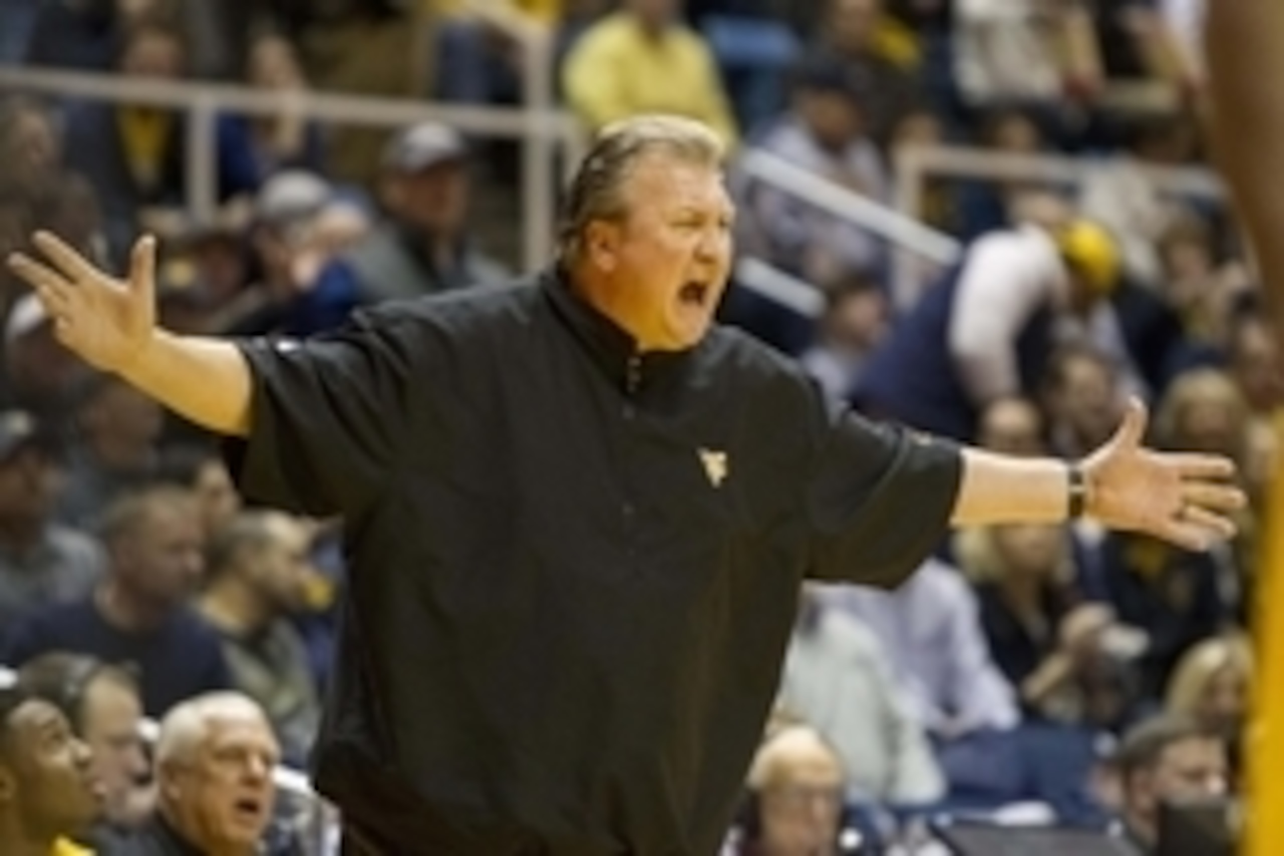 Jan 12, 2016; Morgantown, WV, USA; West Virginia Mountaineers head coach Bob Huggins argues with a referee during the first half at the WVU Coliseum. Mandatory Credit: Ben Queen-USA TODAY Sports