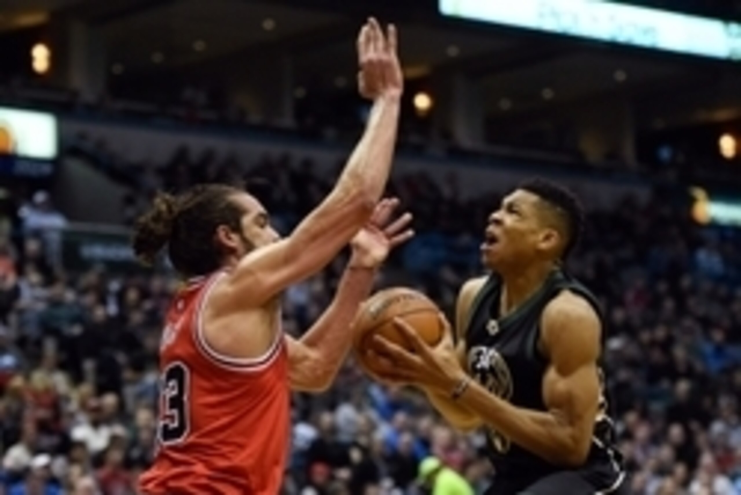 Jan 12, 2016; Milwaukee, WI, USA; Milwaukee Bucks forward Giannis Antetokounmpo (34) takes a shot against Chicago Bulls center Joakim Noah (13) in the second quarter at BMO Harris Bradley Center. Mandatory Credit: Benny Sieu-USA TODAY Sports