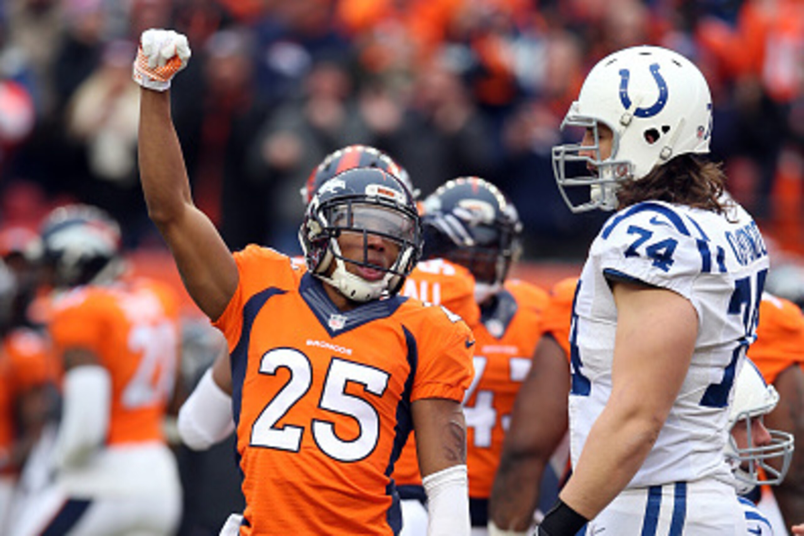 DENVER, CO - JANUARY 11: Chris Harris Jr. #25 of the Denver Broncos celebrates during the game against the Indianapolis Colts during the 2015 AFC Divisional Playoff game at Sports Authority Field at Mile High on January 11, 2015 in Denver, Colorado. The C