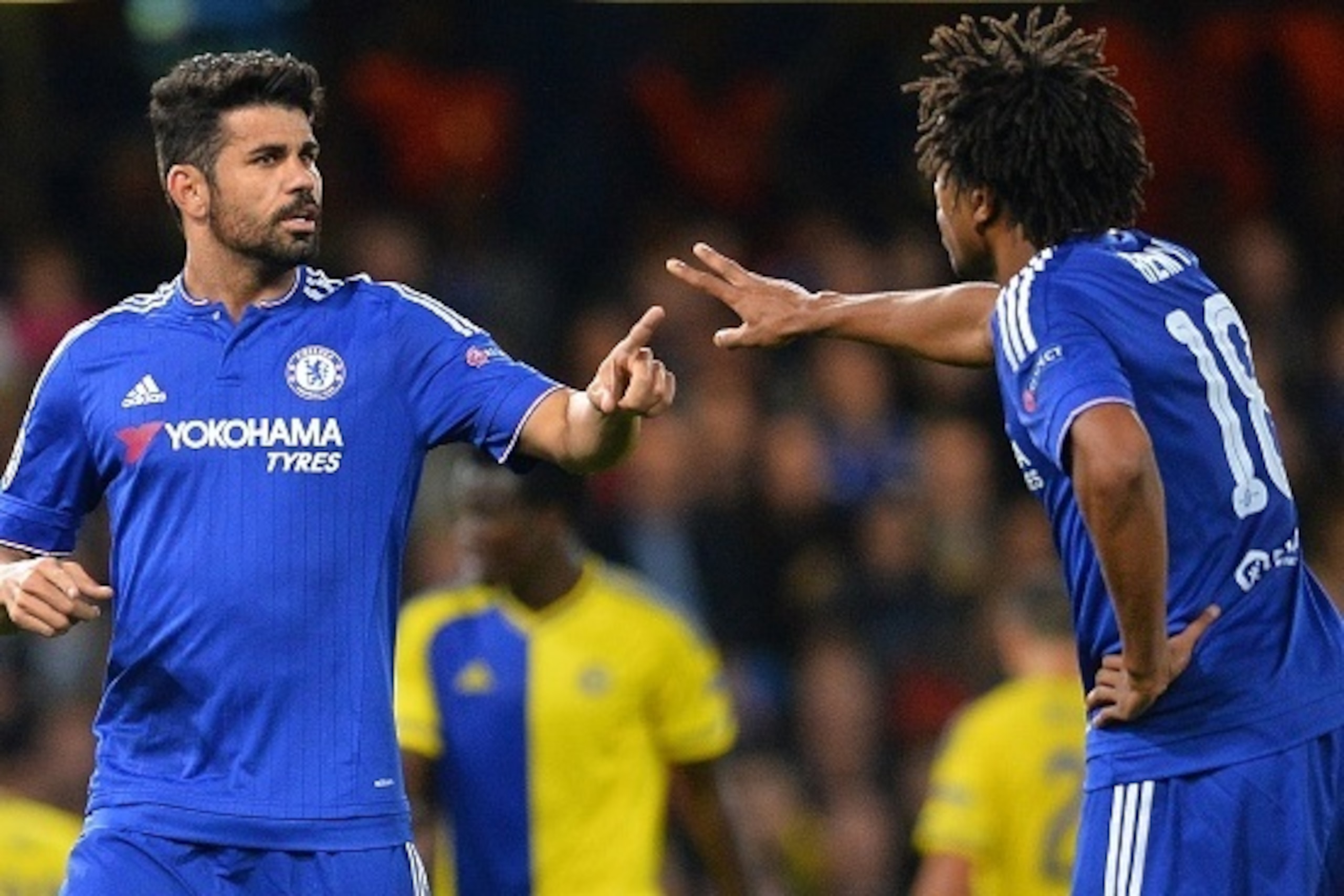Chelsea's Brazilian-born Spanish striker Diego Costa (L) and Chelsea's French striker Loic Remy excahnge words during the UEFA Champions League, group G, football match between Chelsea and Maccabi Tel Aviv at Stamford Bridge in London on September 16, 201