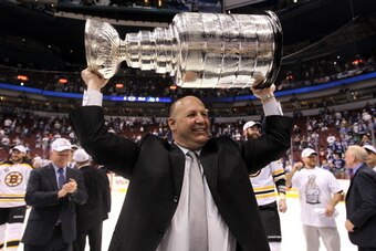 VANCOUVER, BC - JUNE 15:  Head coach Claude Julien pose with the Stanley Cup after defeating the Vancouver Canucks in Game Seven of the 2011 NHL Stanley Cup Final at Rogers Arena on June 15, 2011 in Vancouver, British Columbia, Canada. The Boston Bruins d