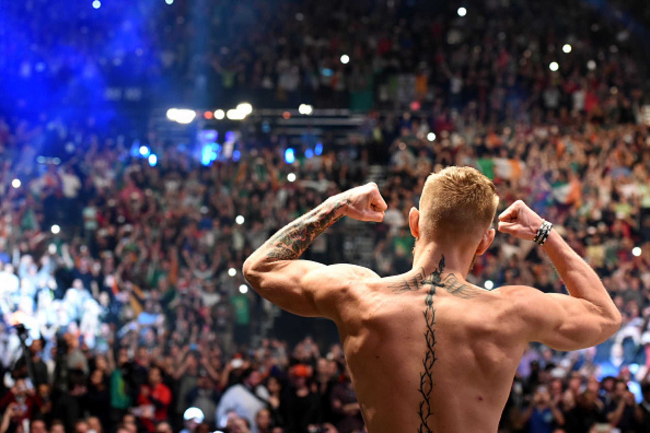 LAS VEGAS, NV - DECEMBER 11:   UFC interim featherweight champion Conor McGregor of Ireland waves to the crowd after making weight during the UFC 194 weigh-in inside MGM Grand Garden Arena on December 10, 2015 in Las Vegas, Nevada.  (Photo by Mike Roach/Z