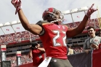 Dec 27, 2015; Tampa, FL, USA;Tampa Bay Buccaneers running back Doug Martin (22) runs out of the tunnel before the game against the Chicago Bears at Raymond James Stadium. Mandatory Credit: Kim Klement-USA TODAY Sports