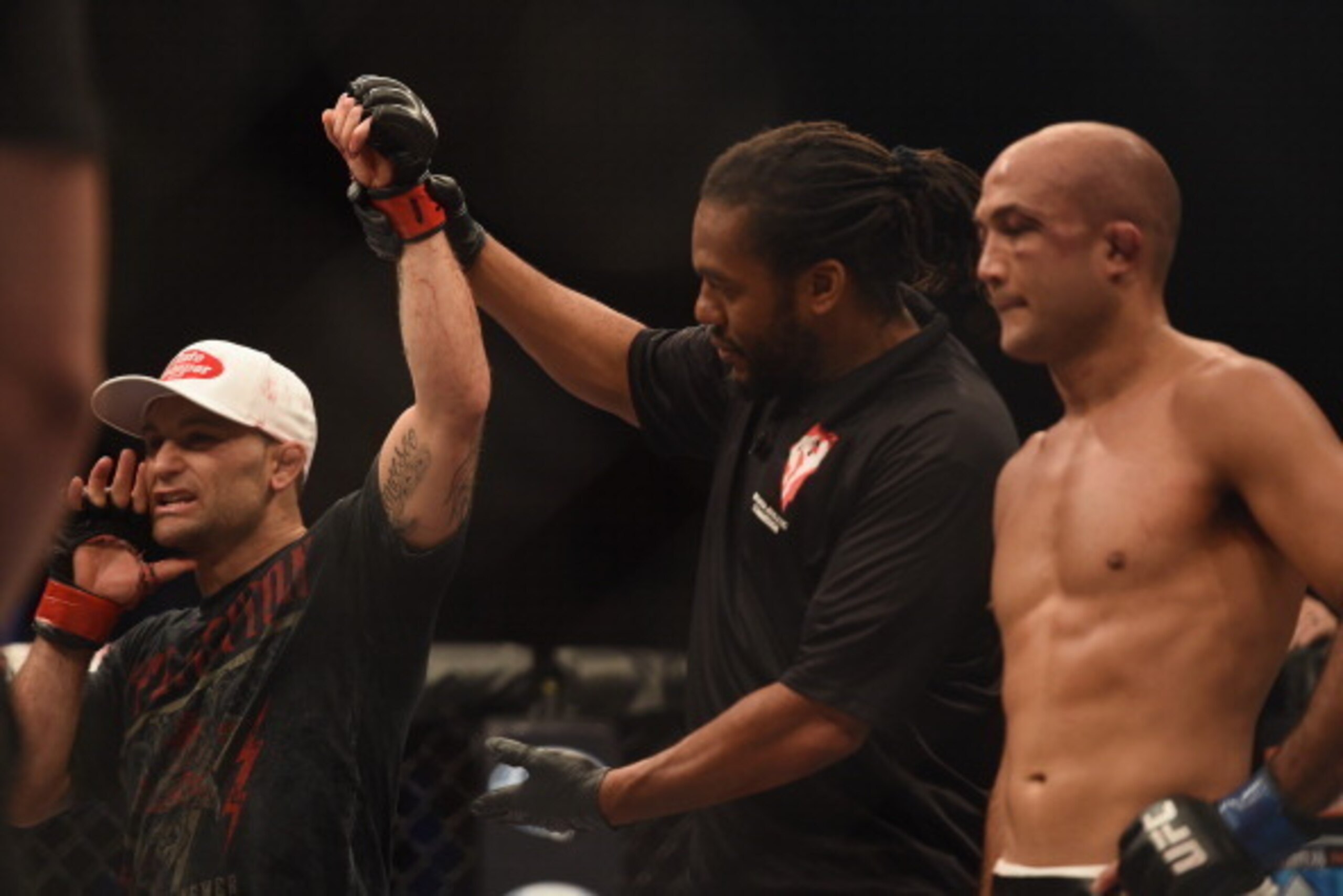 LAS VEGAS, NV - JULY 06:  (L-R) Frankie Edgar celebrates after defeating BJ Penn in their featherweight fight during the Ultimate Fighter Finale inside the Mandalay Bay Events Center on July 6, 2014 in Las Vegas, Nevada.  (Photo by Jeff Bottari/Zuffa LLC/