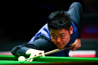 LONDON, ENGLAND - JANUARY 13:  Liang Wenbo of China plays a shot in his first round match against John Higgins of Scotland during Day Four of the Dafabet Masters at Alexandra Palace on January 13, 2016 in London, England.  (Photo by Jordan Mansfield/Getty