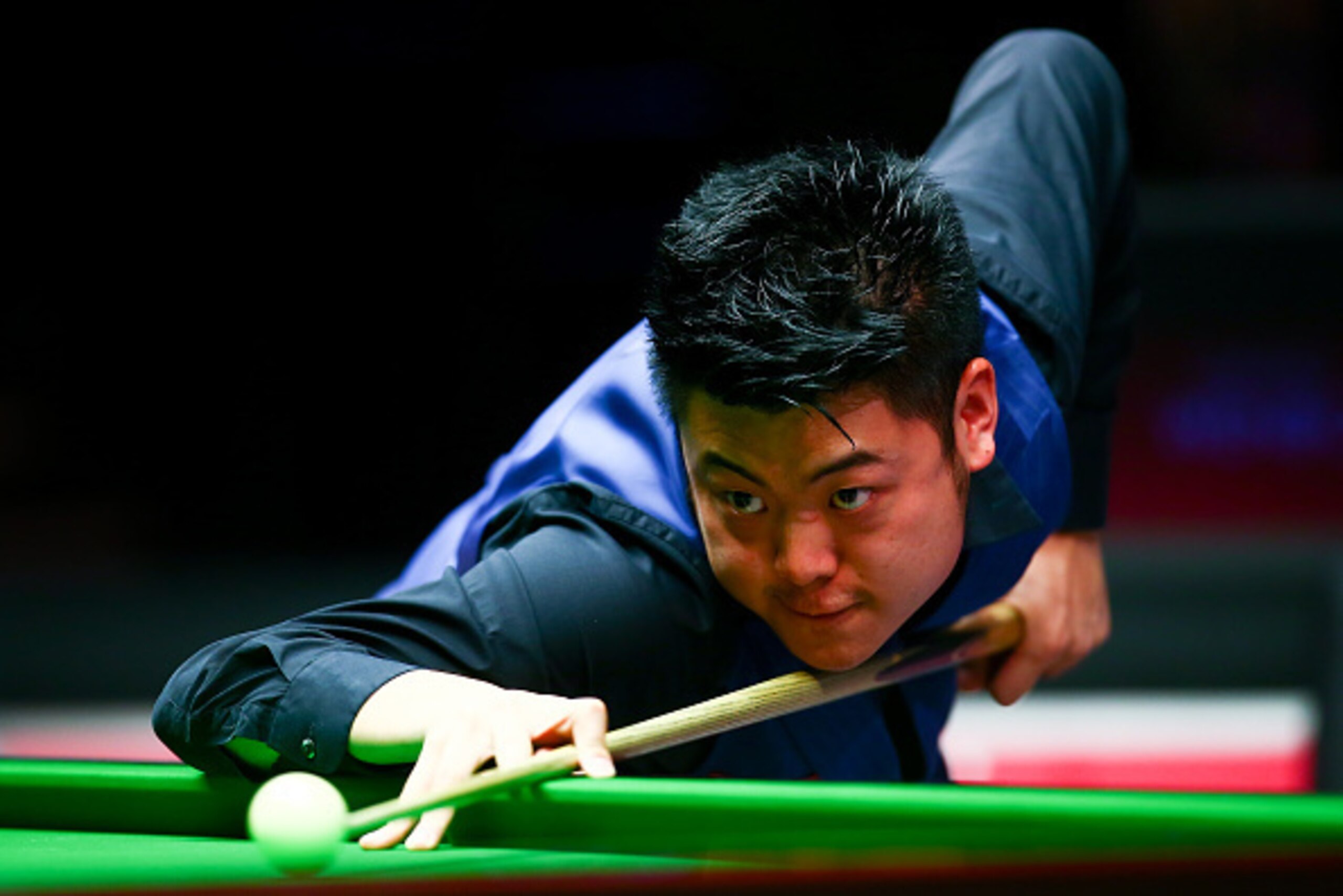 LONDON, ENGLAND - JANUARY 13: Liang Wenbo of China plays a shot in his first round match against John Higgins of Scotland during Day Four of the Dafabet Masters at Alexandra Palace on January 13, 2016 in London, England. (Photo by Jordan Mansfield/Getty LONDON, ENGLAND - JANUARY 13: Liang Wenbo of China plays a shot in his first round match against John Higgins of Scotland during Day Four of the Dafabet Masters at Alexandra Palace on January 13, 2016 in London, England. (Photo by Jordan Mansfield/Getty