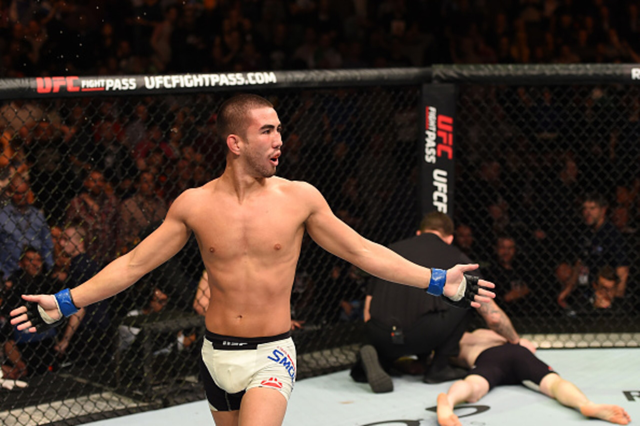 DUBLIN, IRELAND - OCTOBER 24:  (L-R) Louis Smolka celebrates his submission victory over Paddy Holohan in their flyweight fight during the UFC event at 3Arena on October 24, 2015 in Dublin, Ireland. (Photo by Josh Hedges/Zuffa LLC/Zuffa LLC via Getty Imag