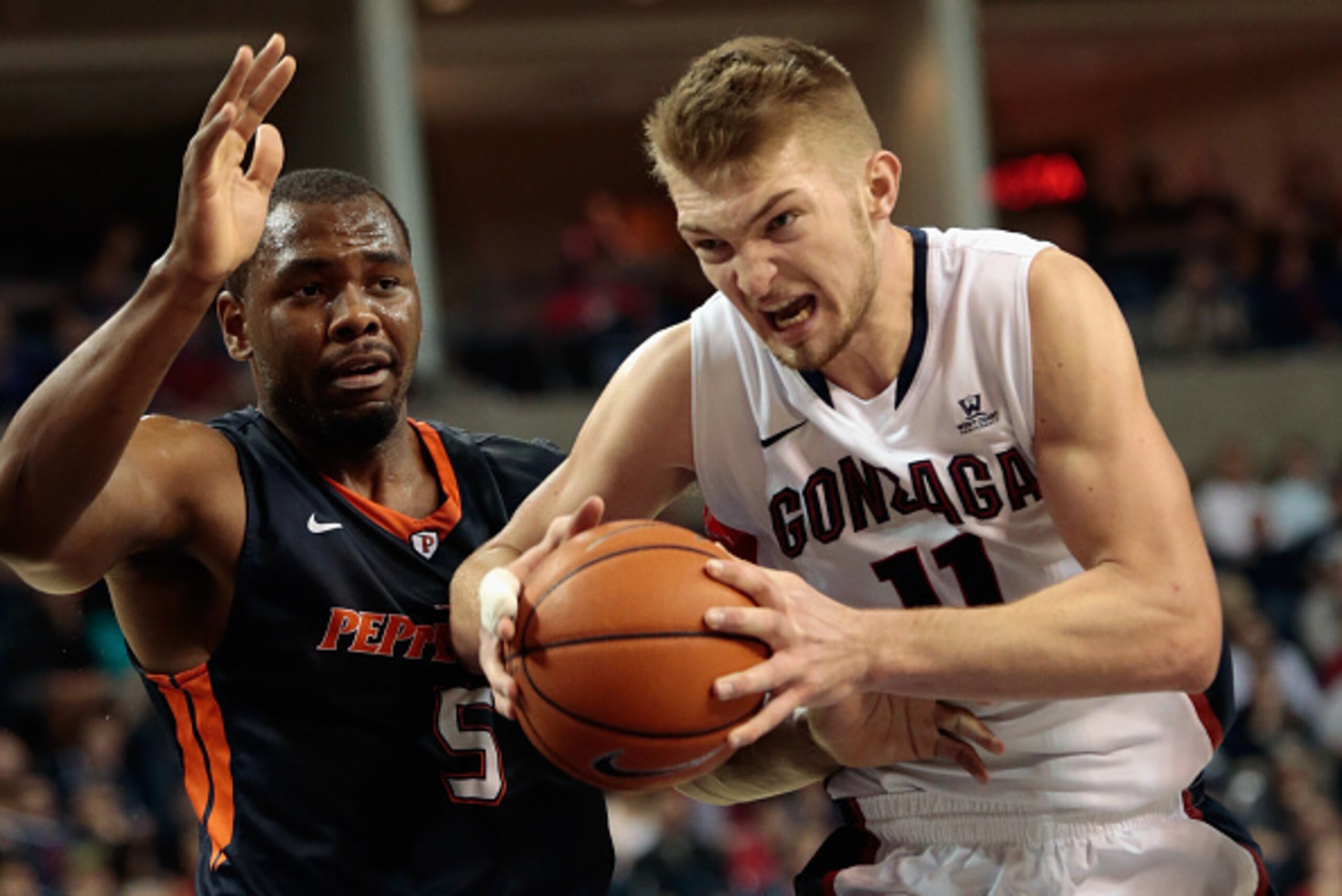SPOKANE, WA - FEBRUARY 14:  Domantas Sabonis #11 of the Gonzaga Bulldogs drives against defender Stacy Davis #5 of the Pepperdine Waves in the second half at McCarthey Athletic Center on February 14, 2015 in Spokane, Washington.  Gonzaga defeated Pepperdi