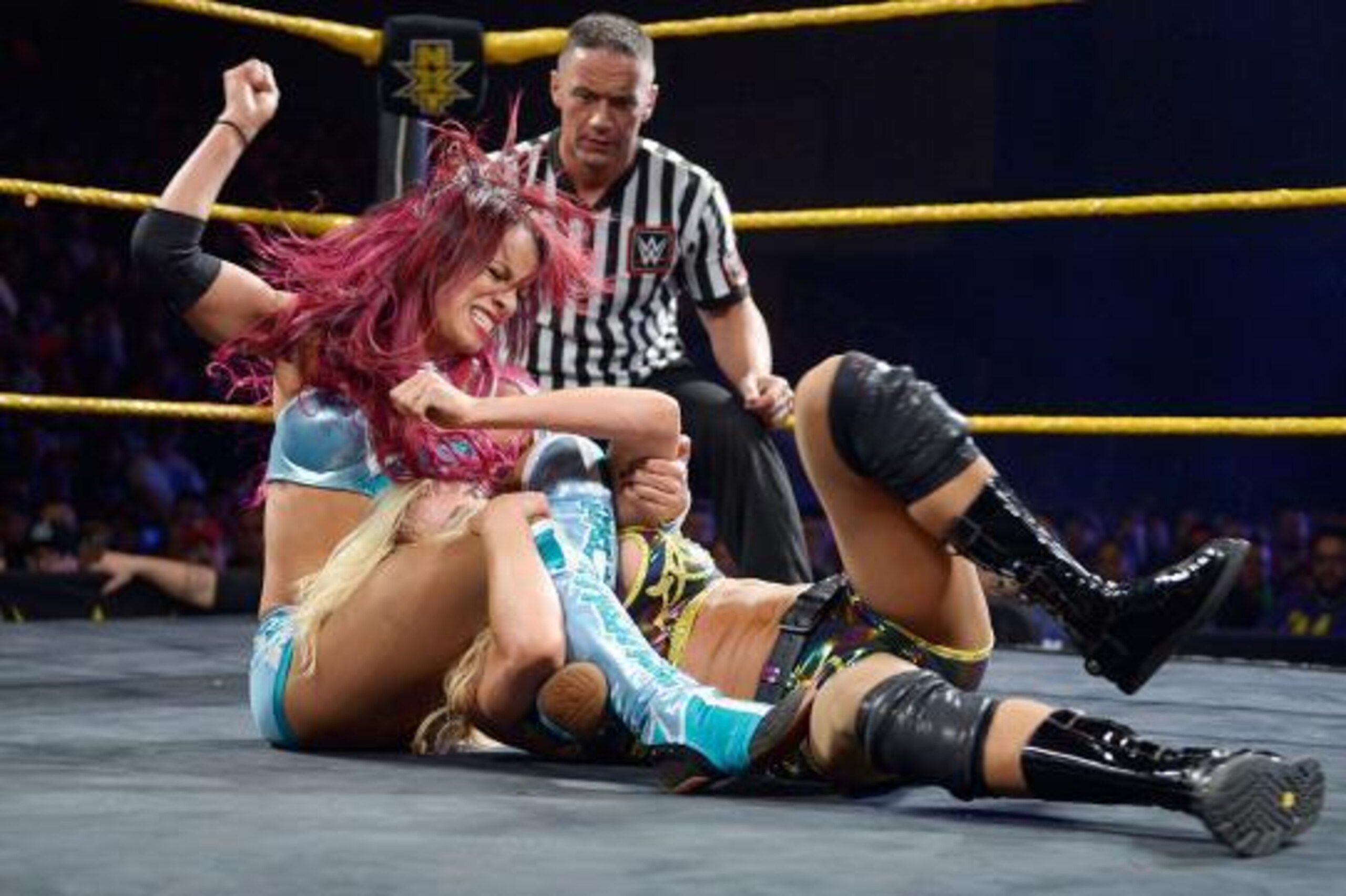 Sasha Banks attacks Charlotte.