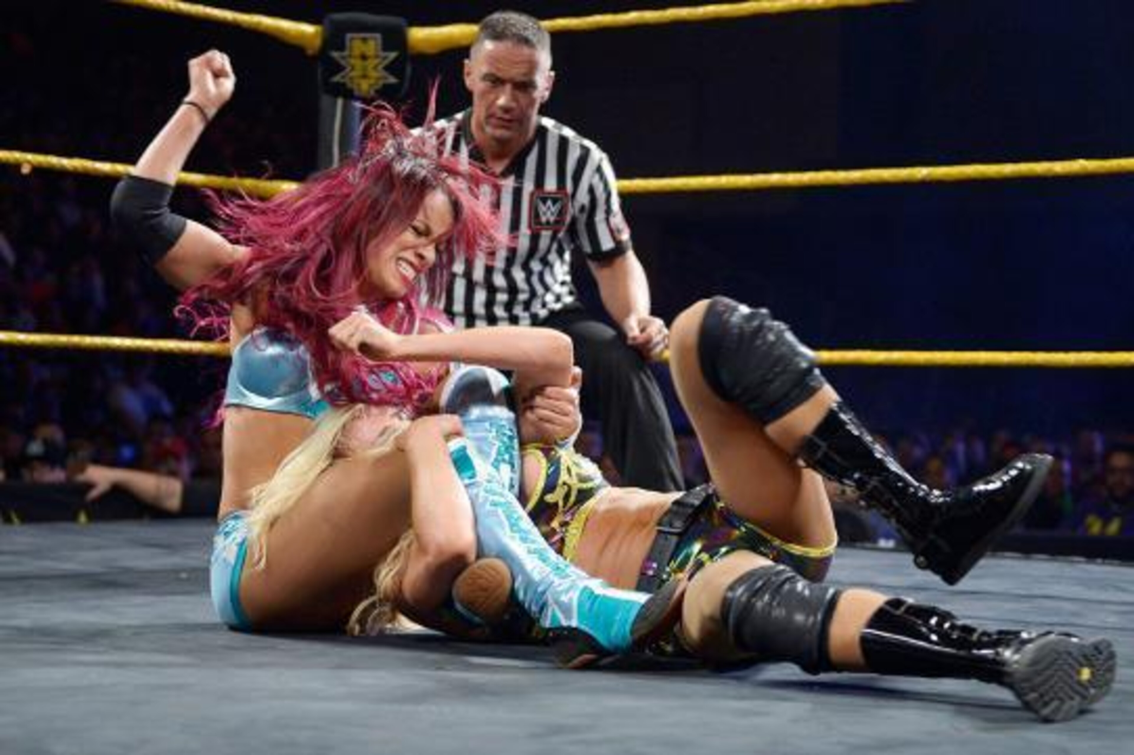 Sasha Banks attacks Charlotte. Sasha Banks attacks Charlotte.