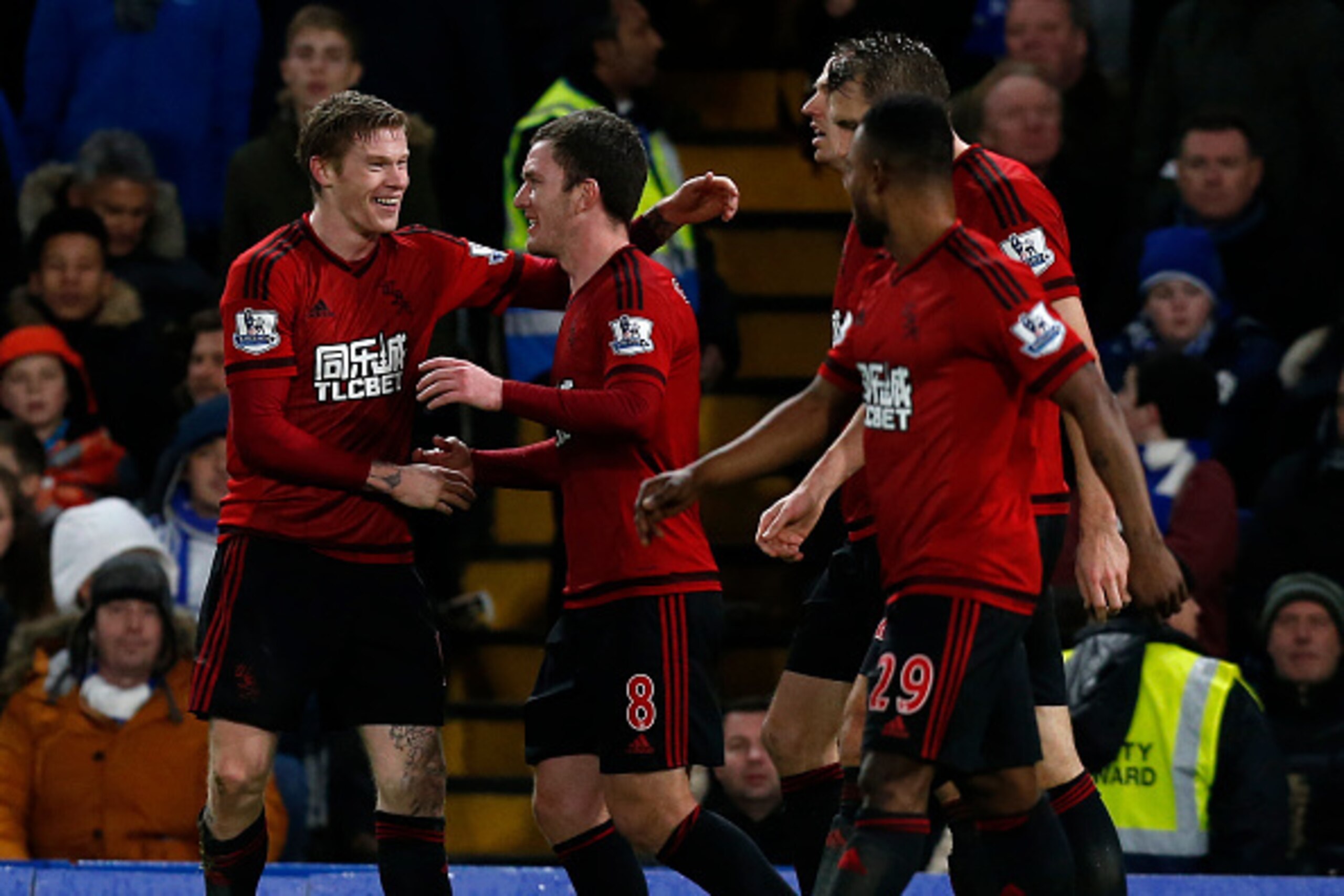West Bromwich Albion's Irish midfielder James McClean (L) celebrates with teammates after scoring their second goal during the English Premier League football match between Chelsea and West Bromwich Albion at Stamford Bridge in London on January 13, 2016.