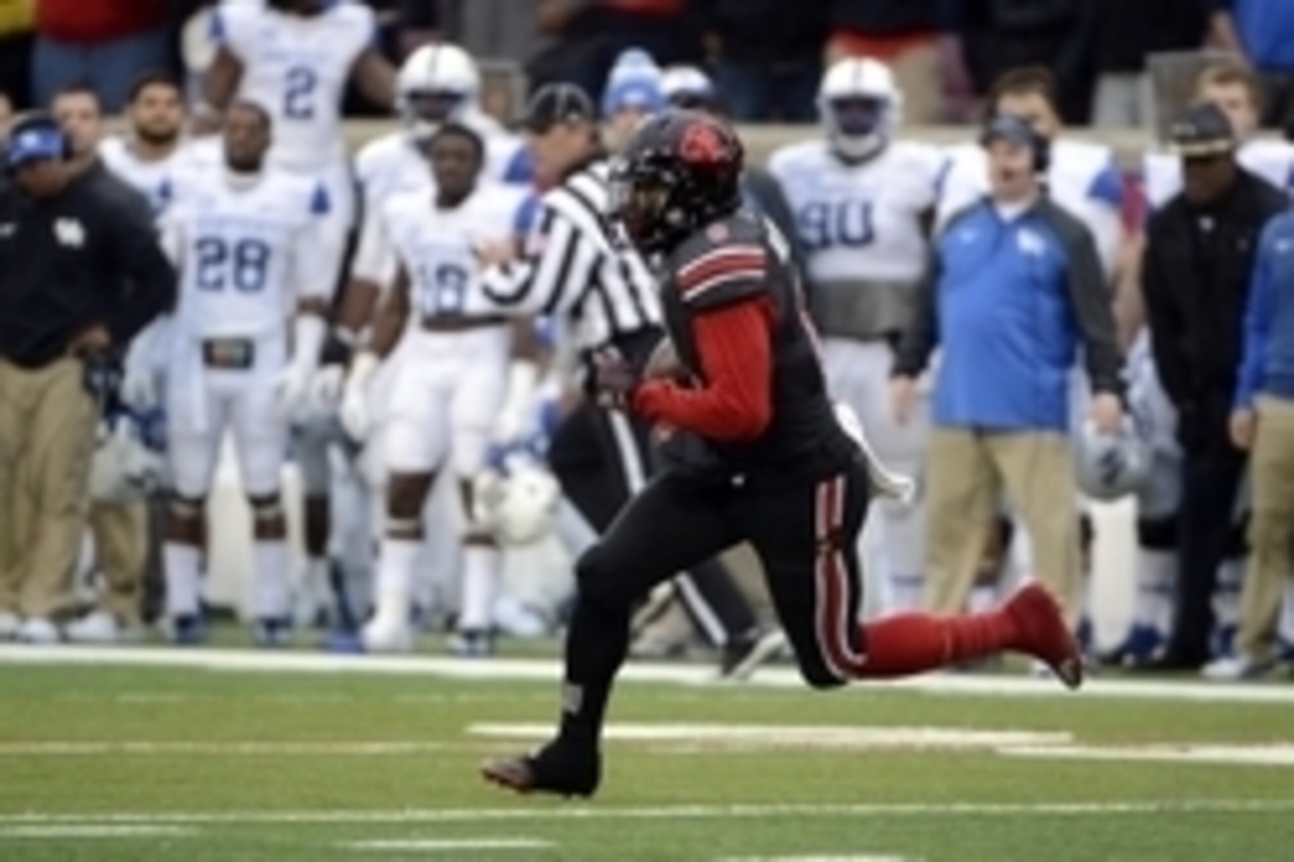 Nov 29, 2014; Louisville, KY, USA; Louisville Cardinals safety Gerod Holliman (8) returns an interception against the Kentucky Wildcats during the second half at Papa John's Cardinal Stadium. Louisville defeated Kentucky 44-40.  Mandatory Credit: Jamie Rh