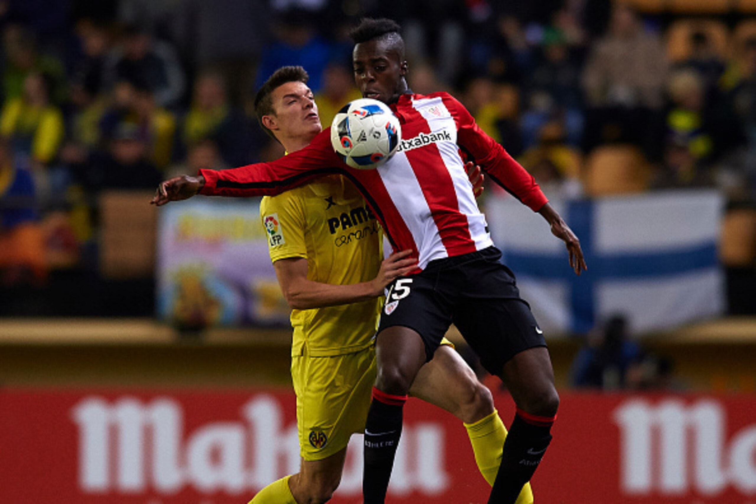 VILLARREAL, SPAIN - JANUARY 13: Adrian Marin (L) of Villarreal competes for the ball with Inaki Williams of Athletic Club during the Copa del Rey Round of 16 second leg match between Villarreal CF and Athletic Club de Bilbao at El Madrigal on January 13 VILLARREAL, SPAIN - JANUARY 13: Adrian Marin (L) of Villarreal competes for the ball with Inaki Williams of Athletic Club during the Copa del Rey Round of 16 second leg match between Villarreal CF and Athletic Club de Bilbao at El Madrigal on January 13
