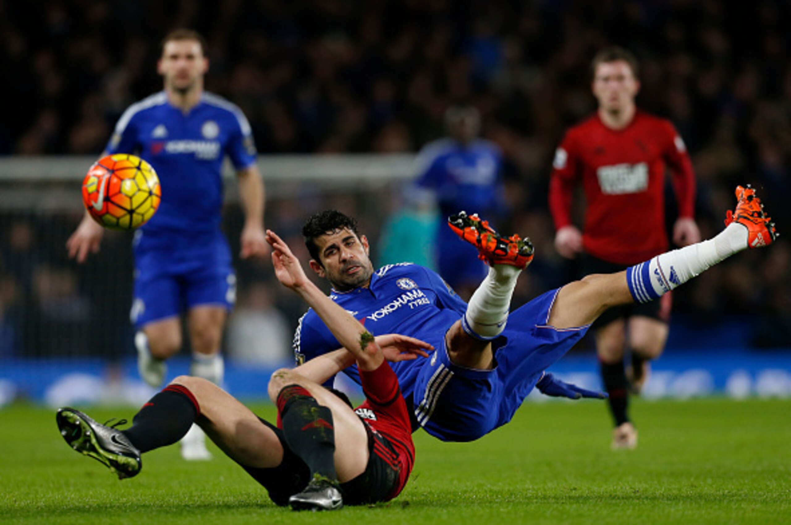 West Bromwich Albion's Northern Irish defender Jonny Evans vies with Chelsea's Brazilian-born Spanish striker Diego Costa (R) during the English Premier League football match between Chelsea and West Bromwich Albion at Stamford Bridge in London on January