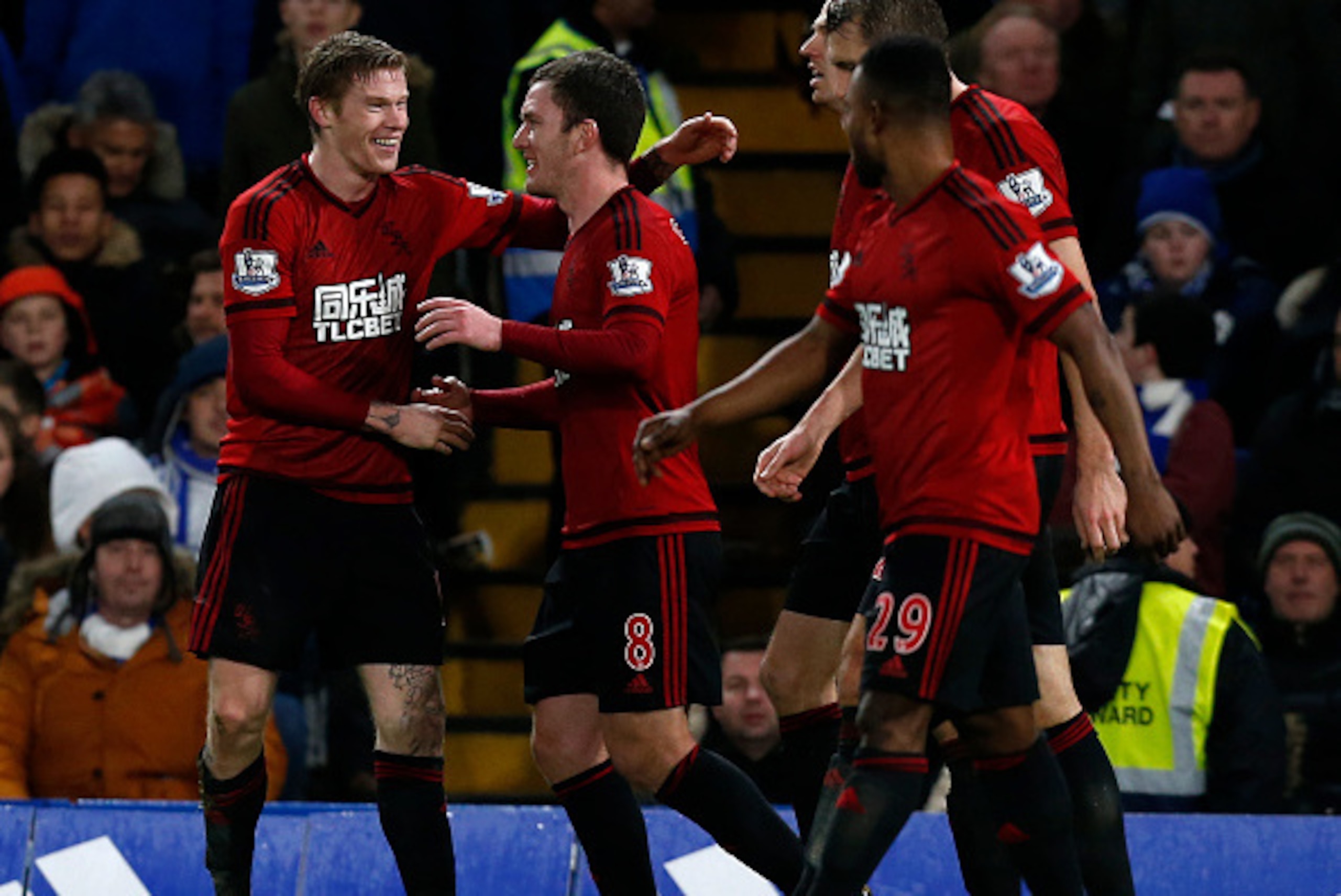 West Bromwich Albion's Irish midfielder James McClean (L) celebrates with teammates after scoring their second goal during the English Premier League football match between Chelsea and West Bromwich Albion at Stamford Bridge in London on January 13, 2016.