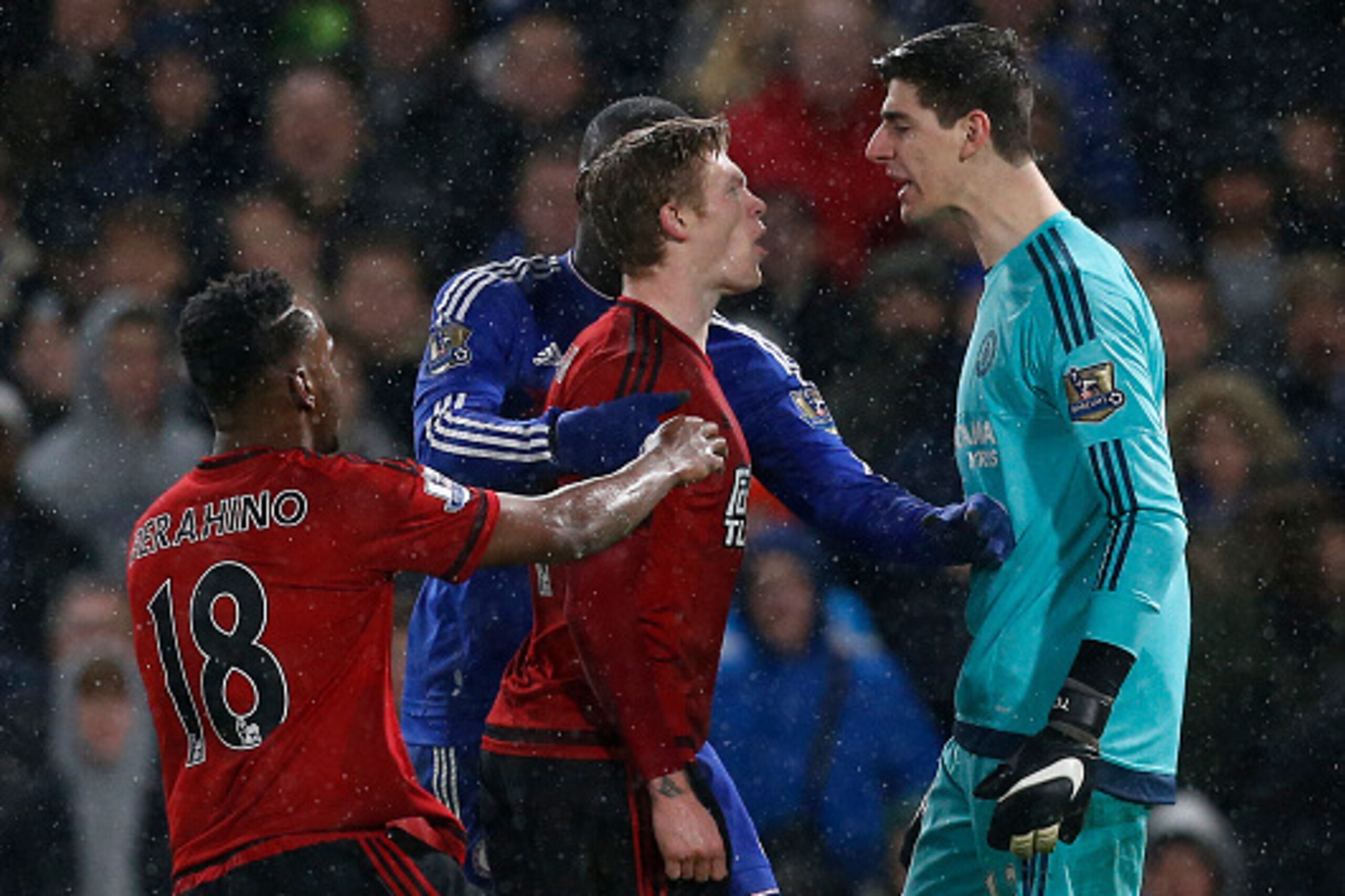 Chelsea's Belgian goalkeeper Thibaut Courtois (R) clashes with West Bromwich Albion's Irish midfielder James McClean during the English Premier League football match between Chelsea and West Bromwich Albion at Stamford Bridge in London on January 13, 2016