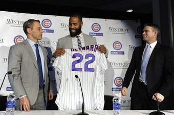 Jed Hoyer and Theo Epstein had plenty of happy press conferences (here, with Jason Heyward), but does that mean the Cubs will win or flop?