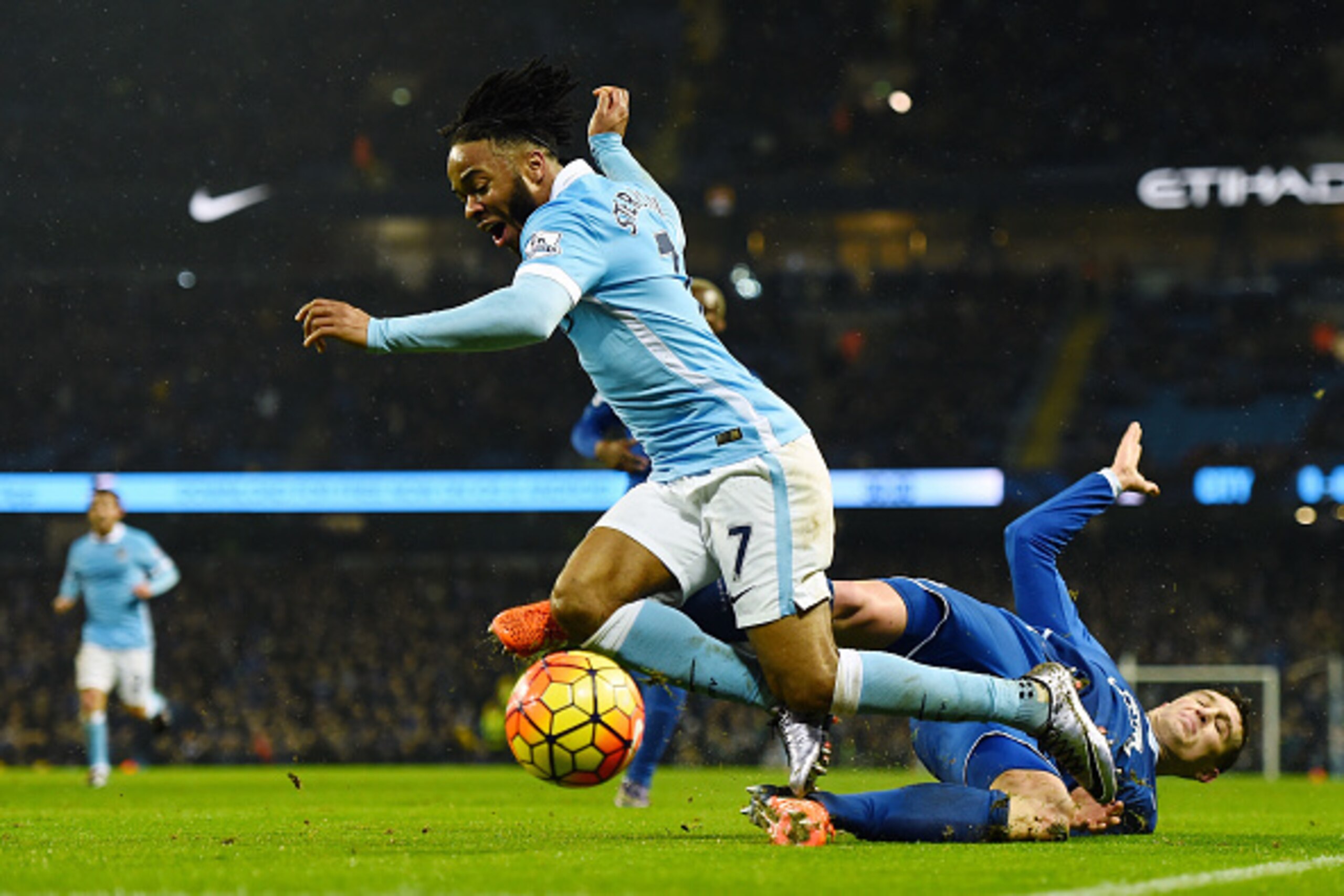 MANCHESTER, ENGLAND - JANUARY 13:  Raheem Sterling of Manchester City is challenged by John Stones of Everton during the Barclays Premier League match between Manchester City and Everton at the Etihad Stadium on January 13, 2016 in Manchester, England.  (