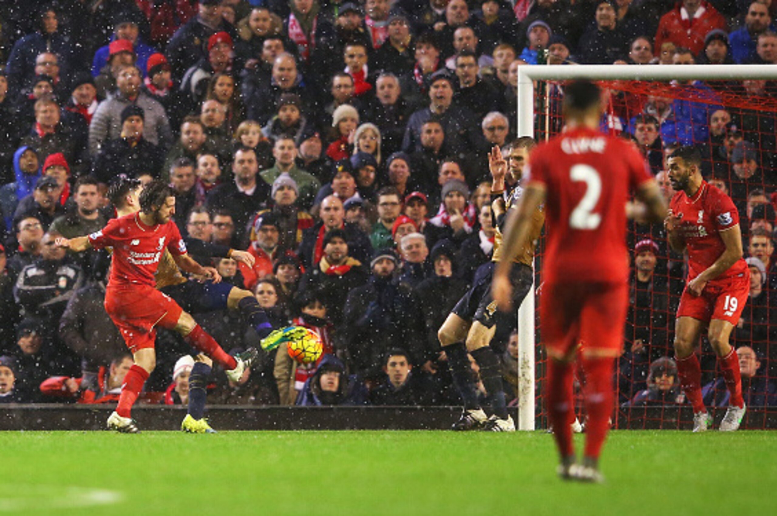 LIVERPOOL, ENGLAND - JANUARY 13: Joe Allen (2nd L) of Liverpool scores his team's third goal during the Barclays Premier League match between Liverpool and Arsenal at Anfield on January 13, 2016 in Liverpool, England.  (Photo by Alex Livesey/Getty Images)