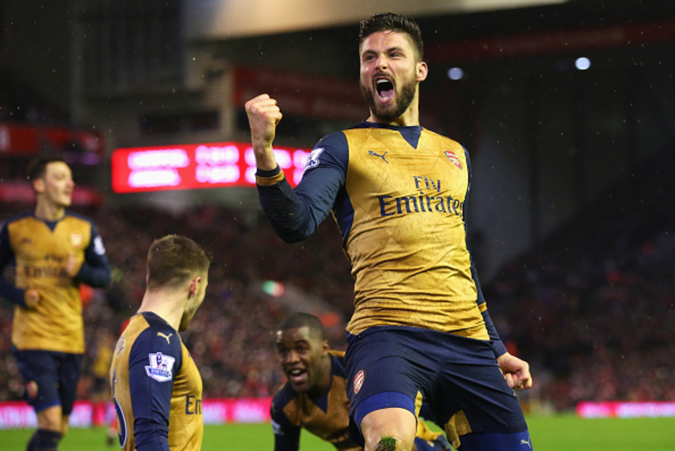 LIVERPOOL, ENGLAND - JANUARY 13:  Olivier Giroud of Arsenal celebrates scoring his team's third goal during the Barclays Premier League match between Liverpool and Arsenal at Anfield on January 13, 2016 in Liverpool, England.  (Photo by Alex Livesey/Getty