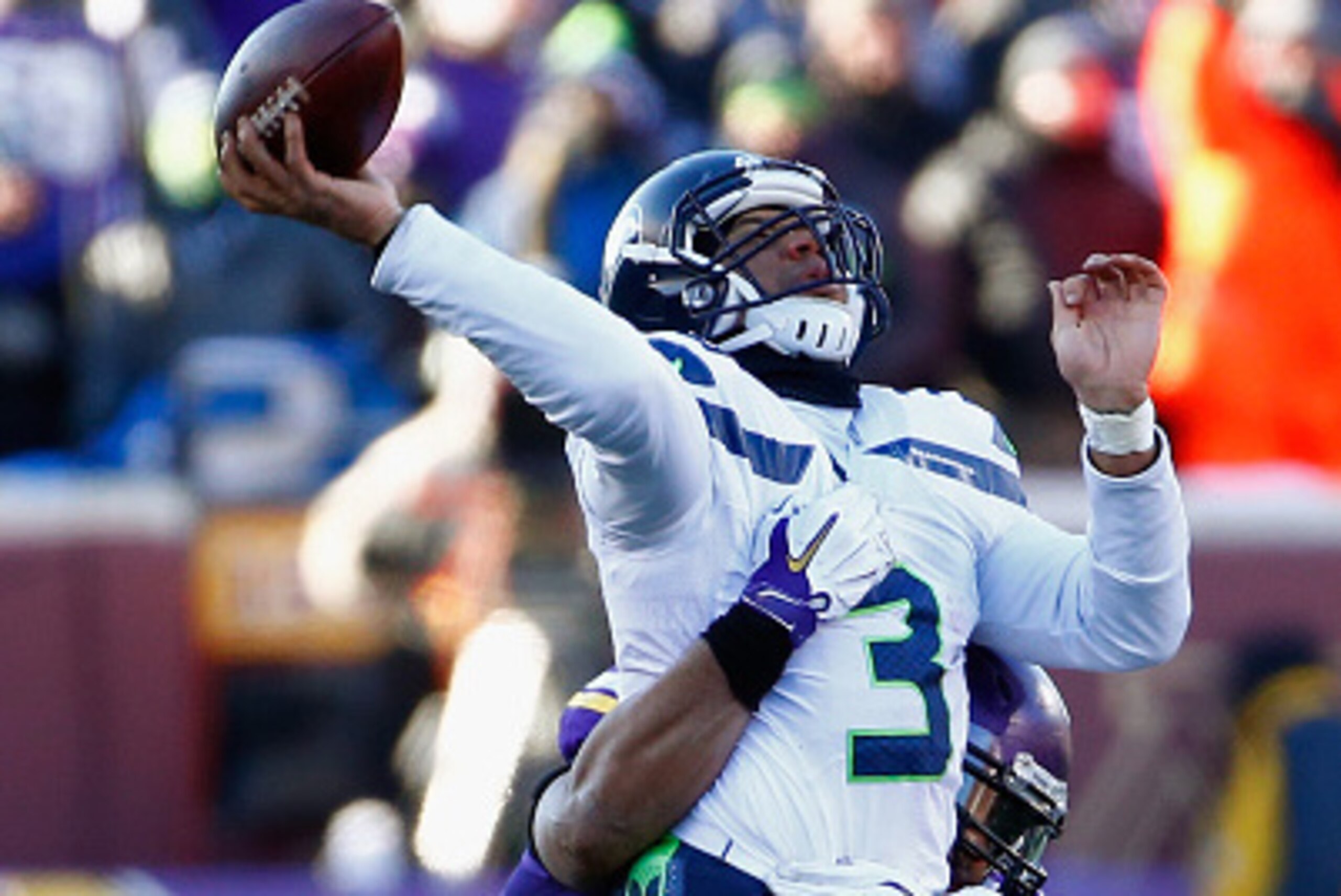 MINNEAPOLIS, MN - JANUARY 10:  Everson Griffen #97 of the Minnesota Vikings attempts to tackle Russell Wilson #3 of the Seattle Seahawks in the fourth quarter during the NFC Wild Card Playoff game at TCFBank Stadium on January 10, 2016 in Minneapolis, Min