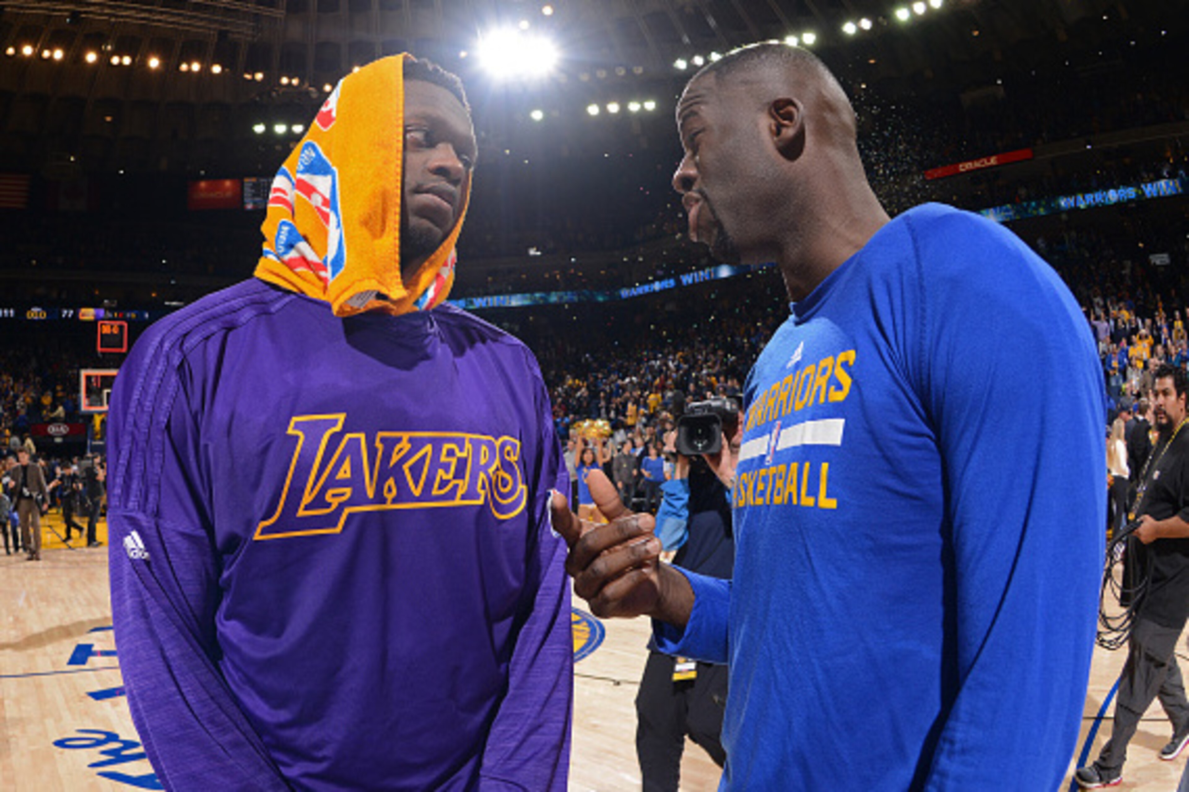OAKLAND, CA - NOVEMBER 24: Julius Randle #30 of the Los Angeles Lakers talks to Draymond Green #23 of the Golden State Warriors after the game on November 24, 2015 at ORACLE Arena in Oakland, California. NOTE TO USER: User expressly acknowledges and agre OAKLAND, CA - NOVEMBER 24: Julius Randle #30 of the Los Angeles Lakers talks to Draymond Green #23 of the Golden State Warriors after the game on November 24, 2015 at ORACLE Arena in Oakland, California. NOTE TO USER: User expressly acknowledges and agre