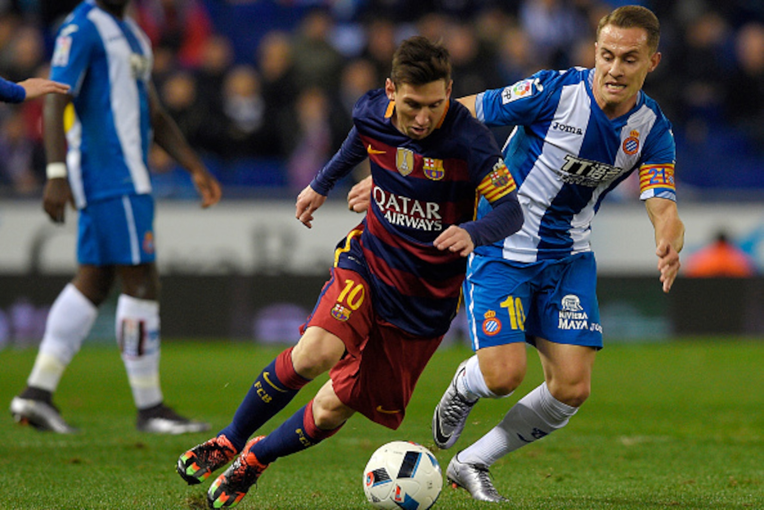 Barcelona's Argentinian forward Lionel Messi (L) vies with Espanyol's midfielder Abraham Gonzalez (R) during the Spanish Copa del Rey (King's Cup) round of 16 second leg football match RCD Espanyol vs FC Barcelona at Cornella-El Prat stadium in Cornella n Barcelona's Argentinian forward Lionel Messi (L) vies with Espanyol's midfielder Abraham Gonzalez (R) during the Spanish Copa del Rey (King's Cup) round of 16 second leg football match RCD Espanyol vs FC Barcelona at Cornella-El Prat stadium in Cornella n