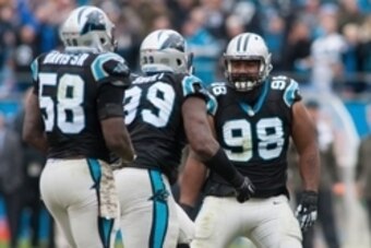 Nov 8, 2015; Charlotte, NC, USA; Carolina Panthers defensive tackle Star Lotulelei (98) celebrates with defensive tackle Kawann Short (99) after a turnover in the first half against the Green Bay Packers at Bank of America Stadium. The Panthers defeated t