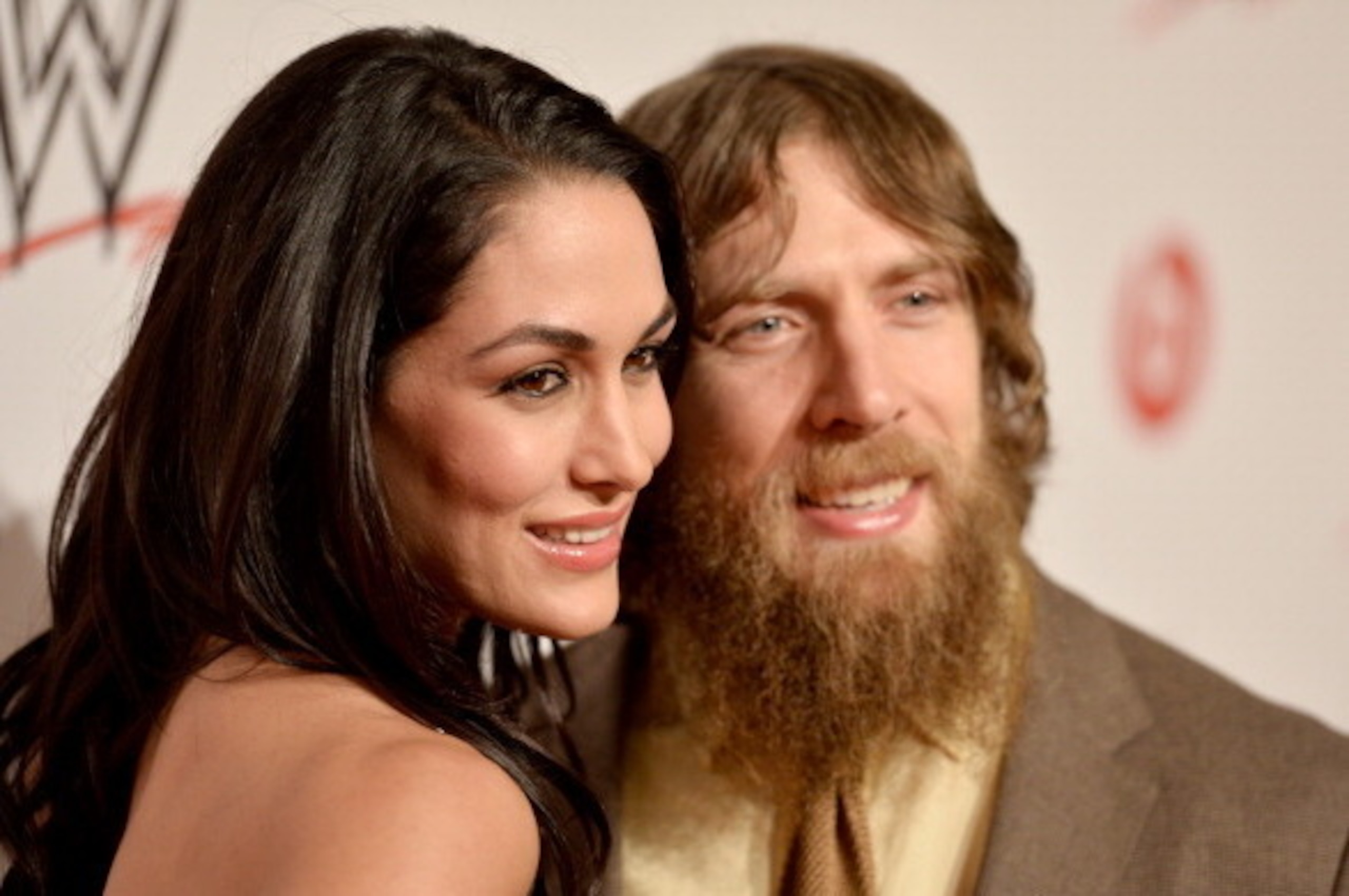BEVERLY HILLS, CA - AUGUST 15:  WWE Diva Brie Bella (L) and wrestler Daniel Bryan attend WWE & E! Entertainment's 'SuperStars For Hope' at the Beverly Hills Hotel on August 15, 2013 in Beverly Hills, California.  (Photo by Frazer Harrison/Getty Images for