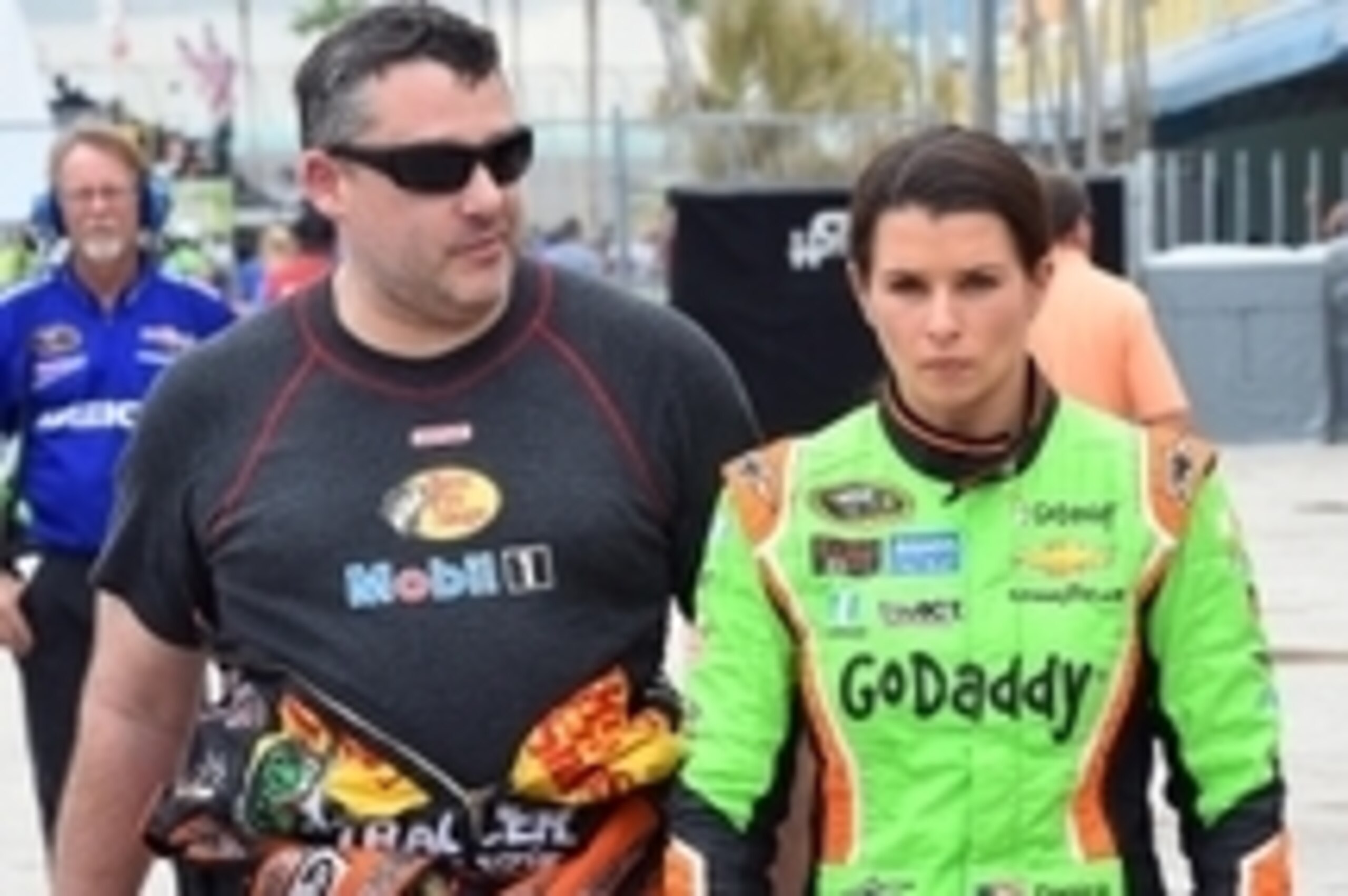 Nov 20, 2015; Homestead, FL, USA; Sprint Cup Series driver Tony Stewart (14) and Sprint Cup Series driver Danica Patrick (10) during practice for the Ford Ecoboost 400 at Homestead-Miami Speedway. Mandatory Credit: Jasen Vinlove-USA TODAY Sports