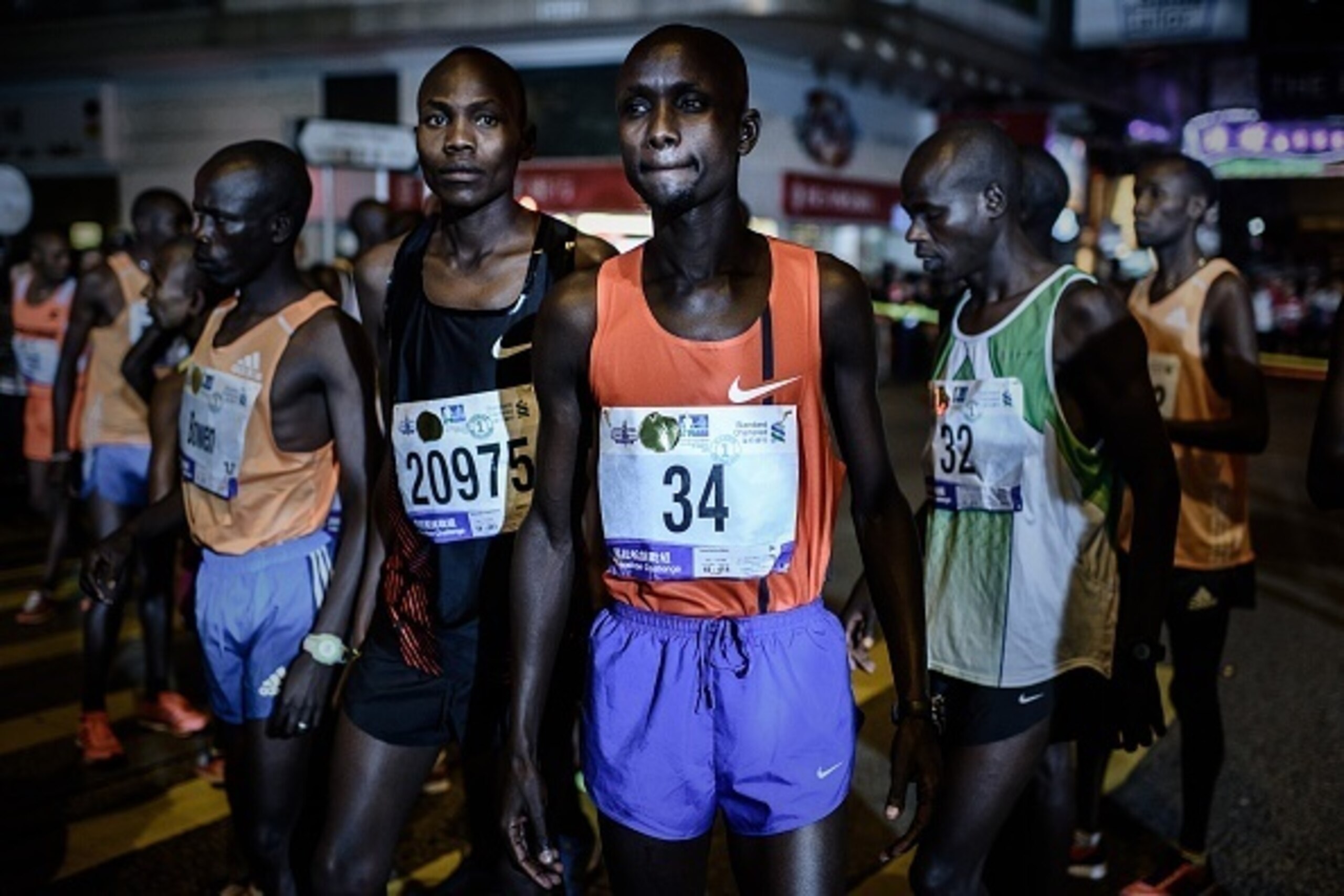 Runners concentrate before the start of the Hong Kong Marathon on January 25, 2015.  About 73,000 people were expected to take to the streets for the Hong Kong Marathon.  AFP PHOTO / Philippe Lopez        (Photo credit should read PHILIPPE LOPEZ/AFP/Getty