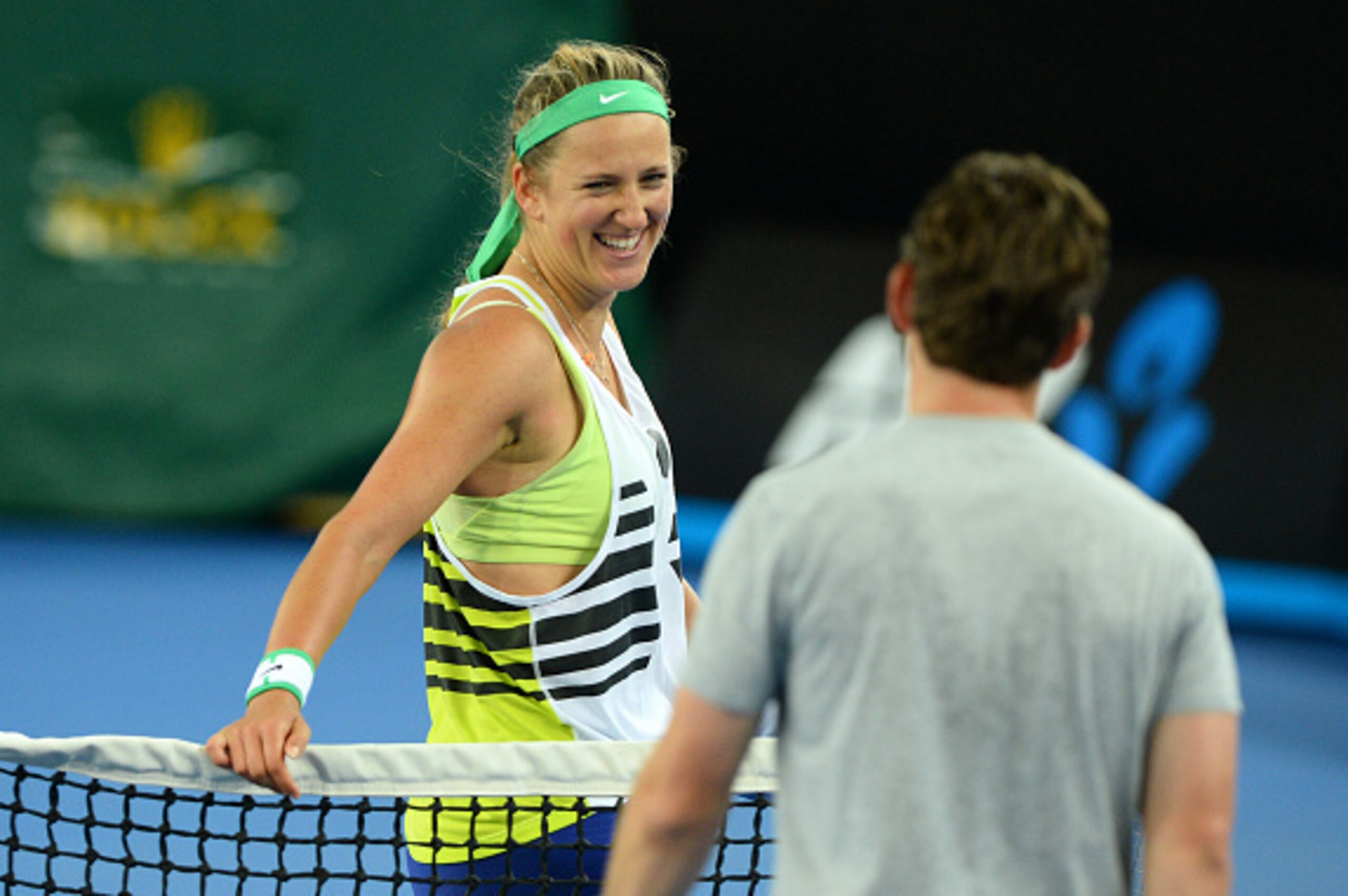 Victoria Azarenka of Belarus smiles as she leaves the court during a practice session ahead of the Australian Open tennis tournament in Melbourne on January 14, 2016. AFP PHOTO / PAUL CROCK --IMAGE RESTRICTED TO EDITORIAL USE - STRICTLY NO COMMERCIAL USE 