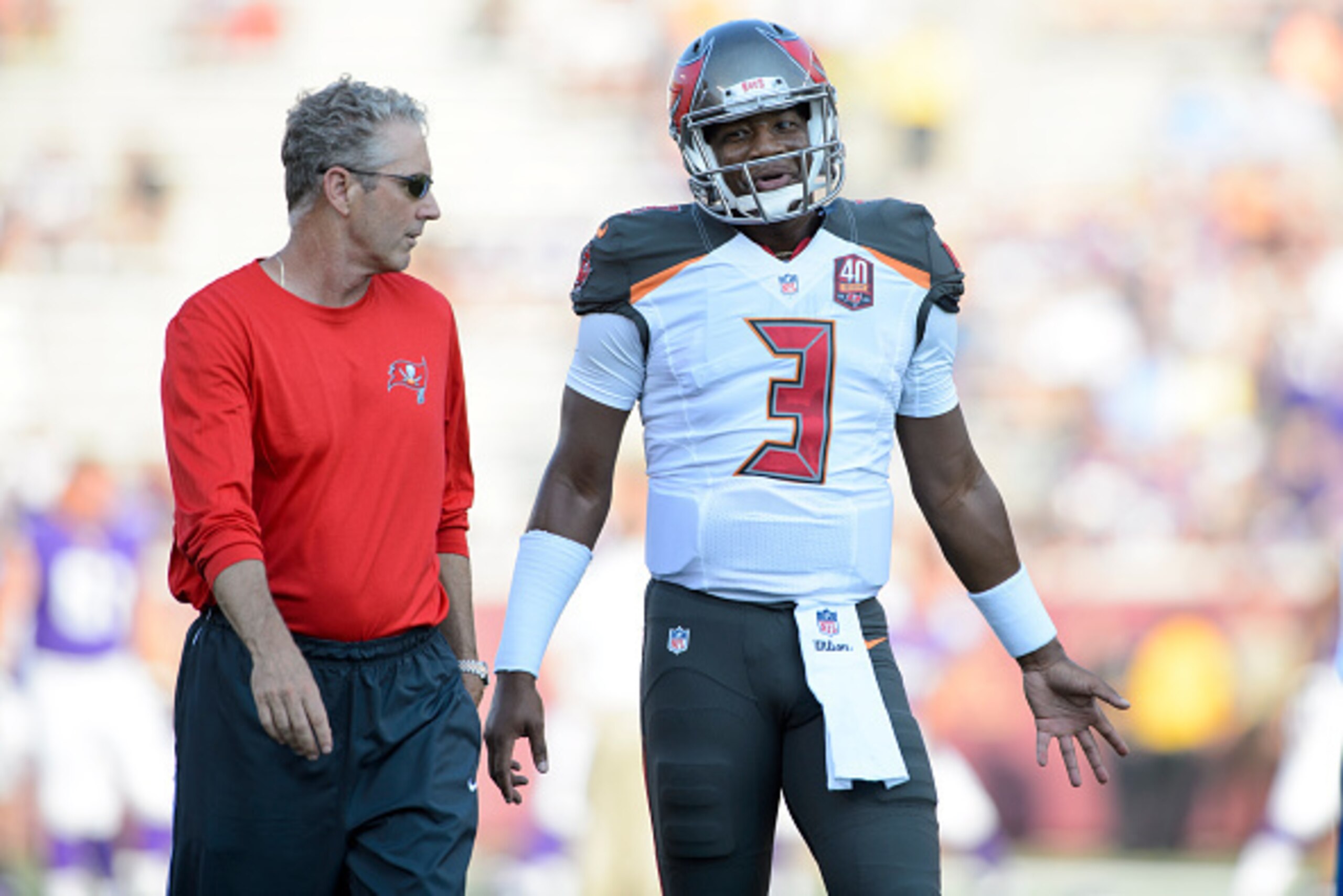 MINNEAPOLIS, MN - AUGUST 15: Jameis Winston #3 of the Tampa Bay Buccaneers speaks with Offensive Coordinator Dirk Koetter before the preseason game against the Minnesota Vikings on August 15, 2015 at TCF Bank Stadium in Minneapolis, Minnesota. The Vikings