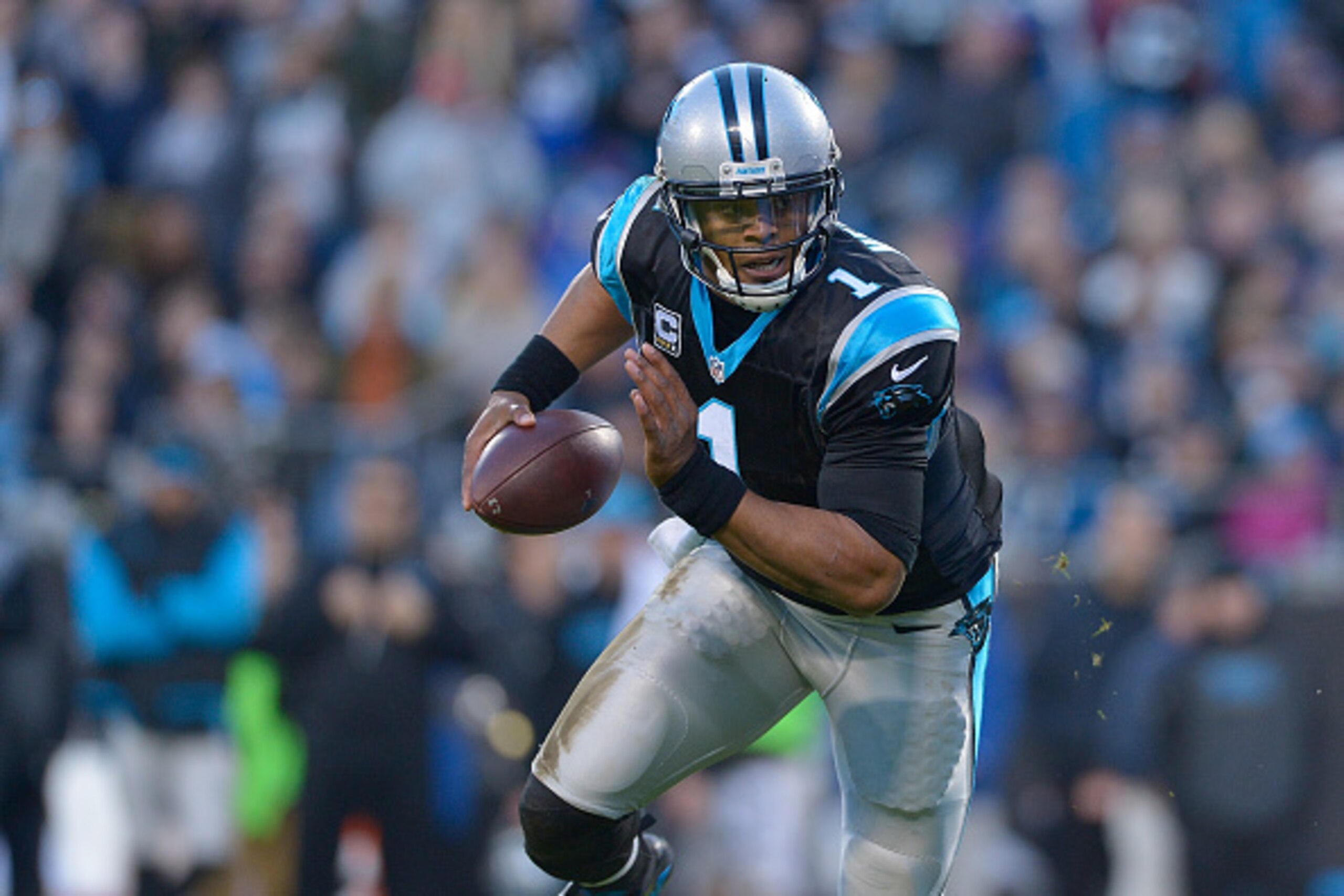 CHARLOTTE, NC - JANUARY 03: Cam Newton #1 of the Carolina Panthers against the Tampa Bay Buccaneers during their game at Bank of America Stadium on January 3, 2016 in Charlotte, North Carolina. The Panthers won 38-10 to clinch home field advantage for th CHARLOTTE, NC - JANUARY 03: Cam Newton #1 of the Carolina Panthers against the Tampa Bay Buccaneers during their game at Bank of America Stadium on January 3, 2016 in Charlotte, North Carolina. The Panthers won 38-10 to clinch home field advantage for th