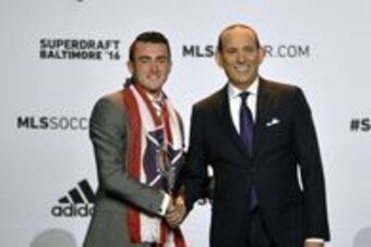 Jan 14, 2016; Baltimore, MD, USA; Jack Harrison shakes hands with commissioner Don Garber after being selected number one overall by the Chicago Fire during the 2016 MLS SuperDraft at Baltimore Convention Center. Mandatory Credit: Tommy Gilligan-USA TODAY