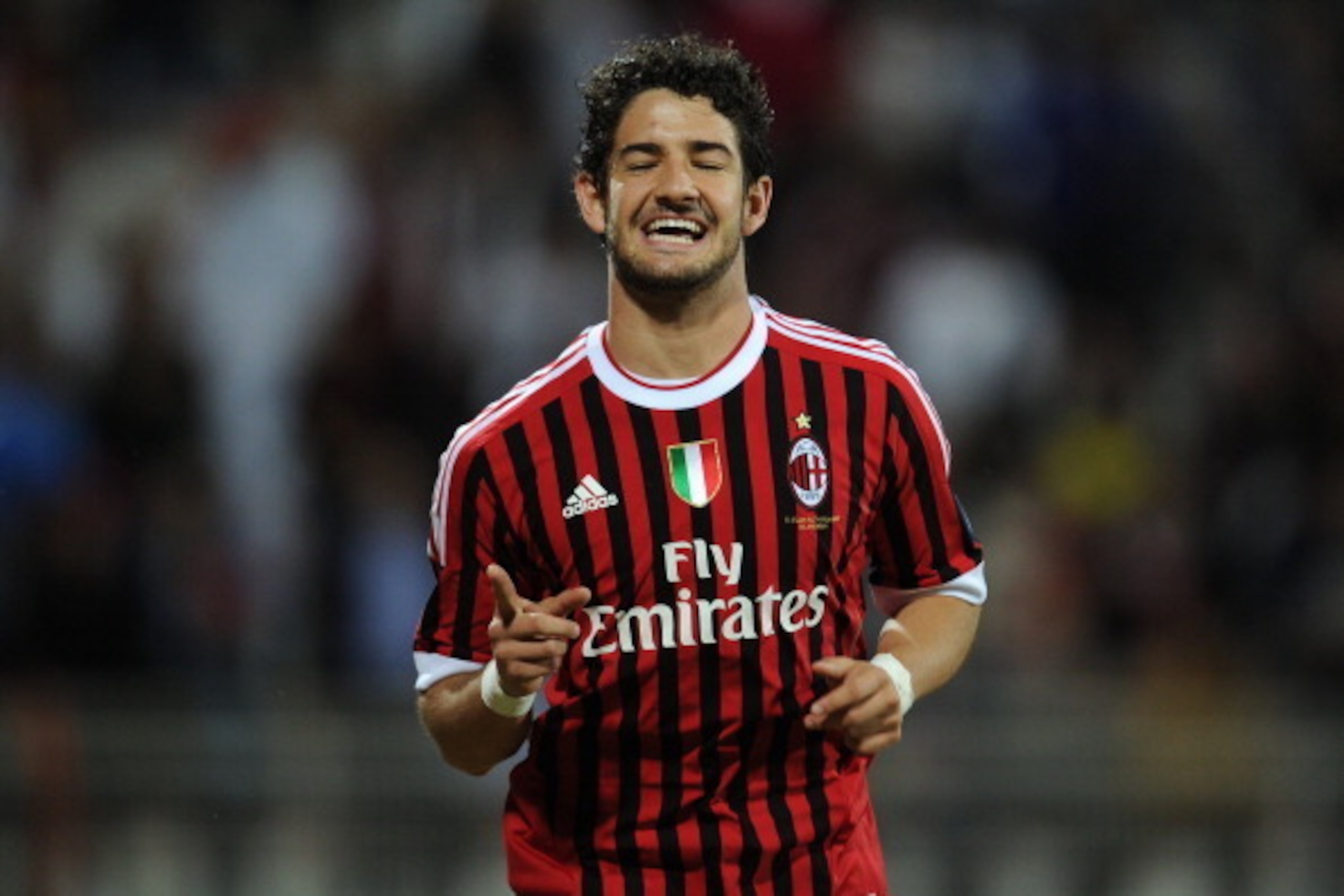 AC Milan's forward Alexandre Pato jubilates after scoring the opening goal during the Challenge Cup football match Paris Saint-Germain vs Milan on January 4, 2012 at the Al-Rashid stadium in Dubai. AFP PHOTO / FRANCK FIFE (Photo credit should read FRANCK 