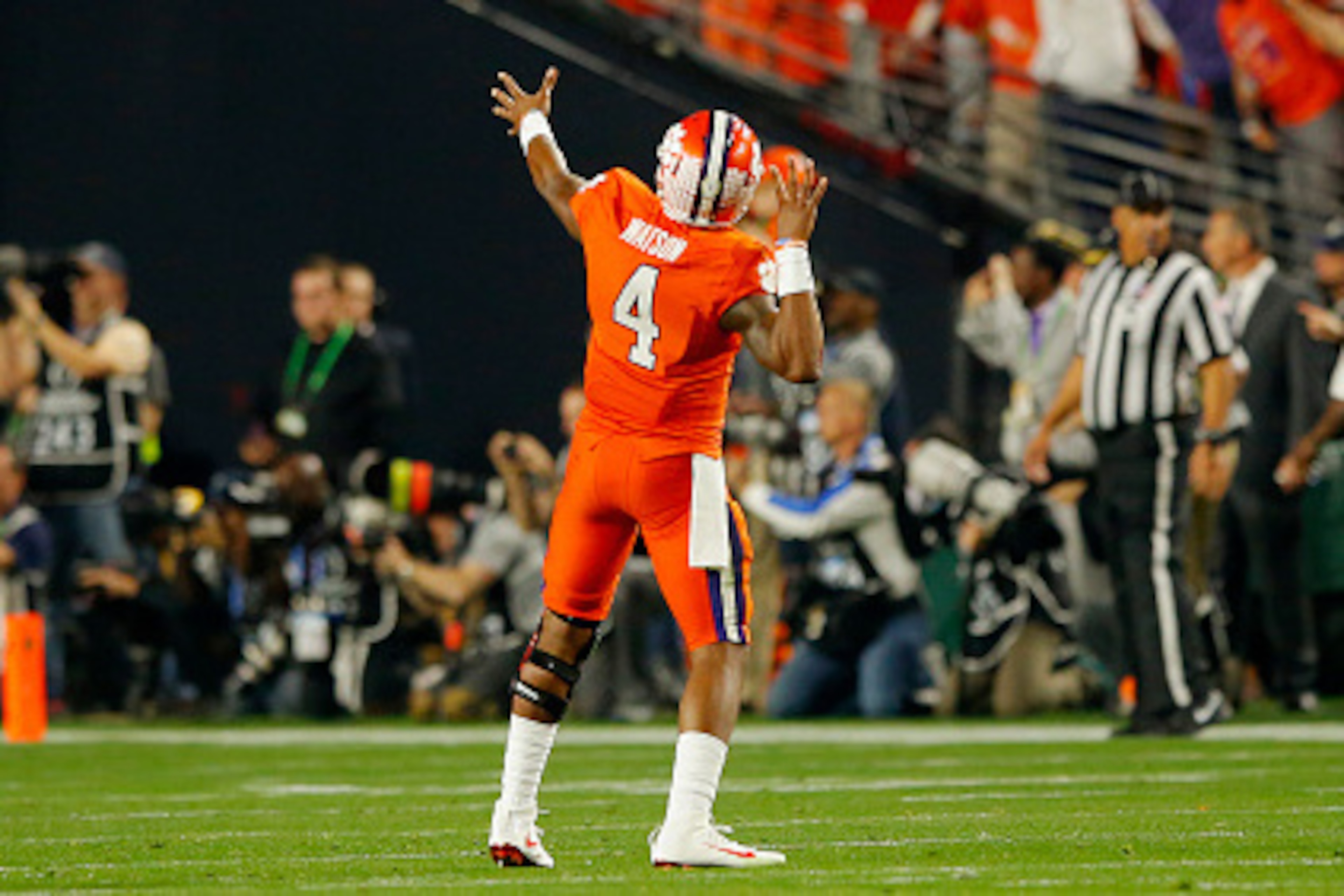 GLENDALE, AZ - JANUARY 11: Deshaun Watson #4 of the Clemson Tigers celebrates after throwing a 31 yard touchdown pass to Hunter Renfrow #13 in the first quarter against the Alabama Crimson Tide during the 2016 College Football Playoff National Championsh GLENDALE, AZ - JANUARY 11: Deshaun Watson #4 of the Clemson Tigers celebrates after throwing a 31 yard touchdown pass to Hunter Renfrow #13 in the first quarter against the Alabama Crimson Tide during the 2016 College Football Playoff National Championsh